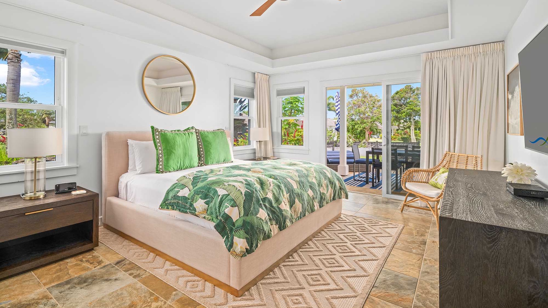 Wake up to bright tropical light flooding your serene bedroom. Step through glass doors onto your private outdoor space, and let the soft coastal breeze welcome your day.