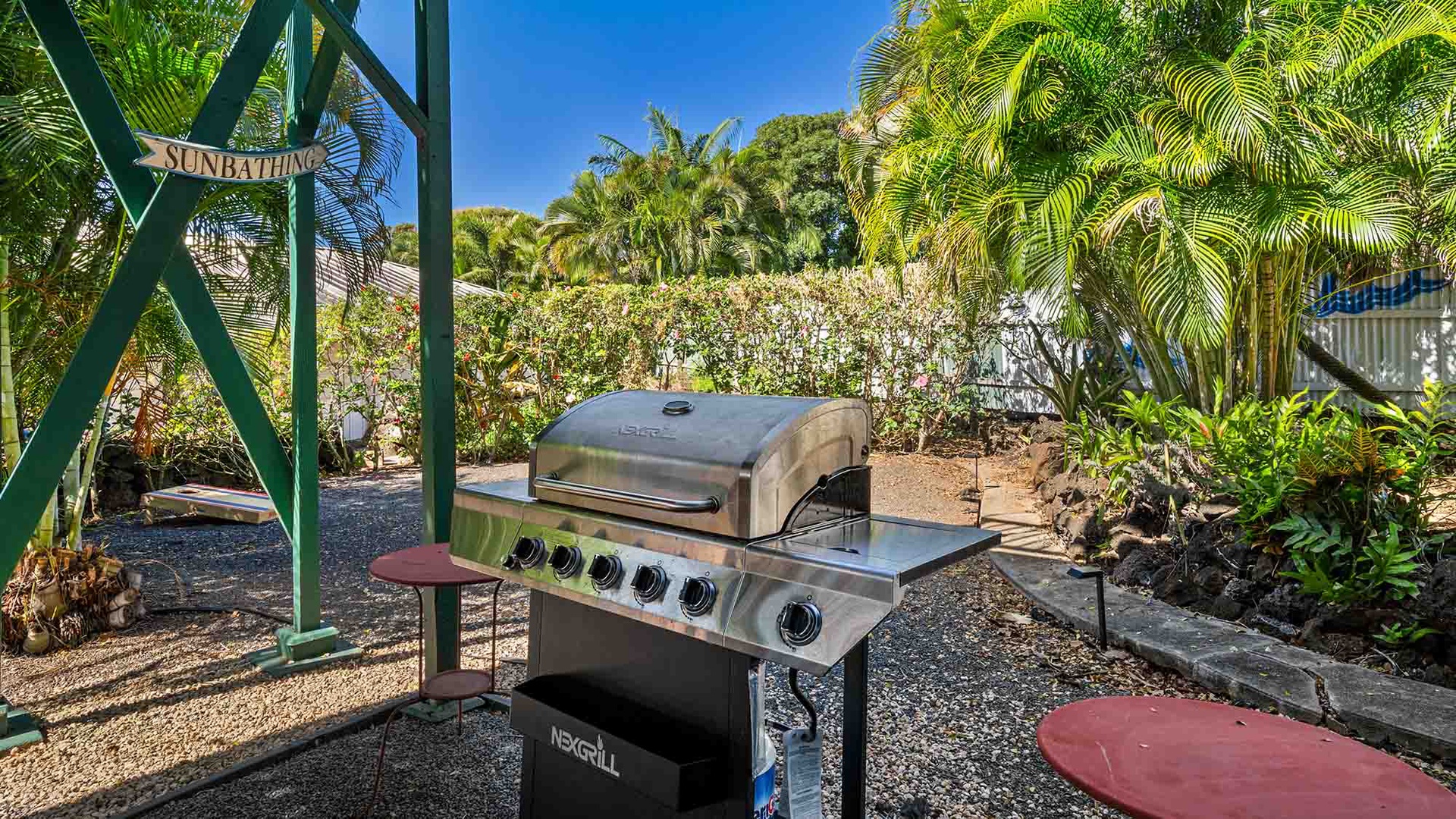 Fire up the grill in your private tropical BBQ area, surrounded by lush palms and vibrant gardens for the perfect outdoor feast.