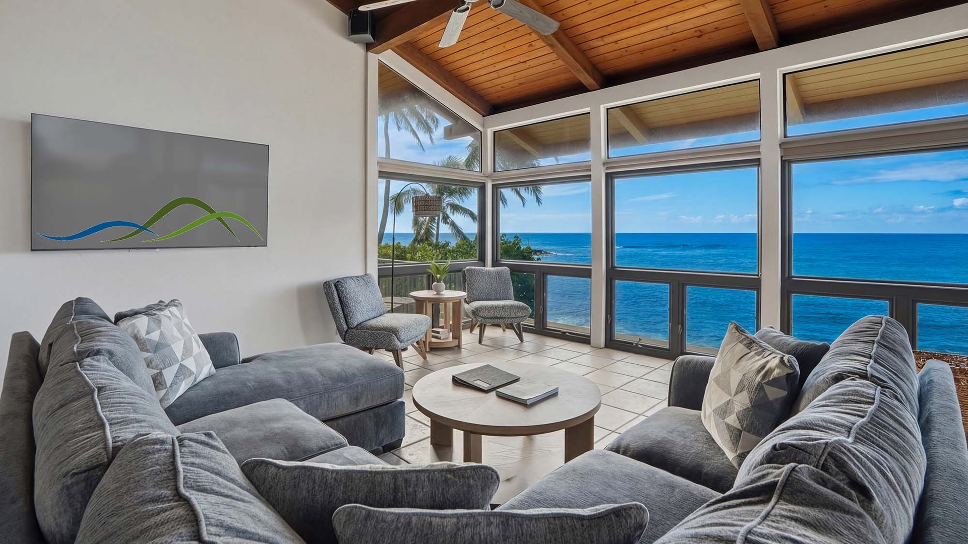 Sink into plush seating while panoramic ocean views fill your days with endless blue horizons and tropical tranquility.