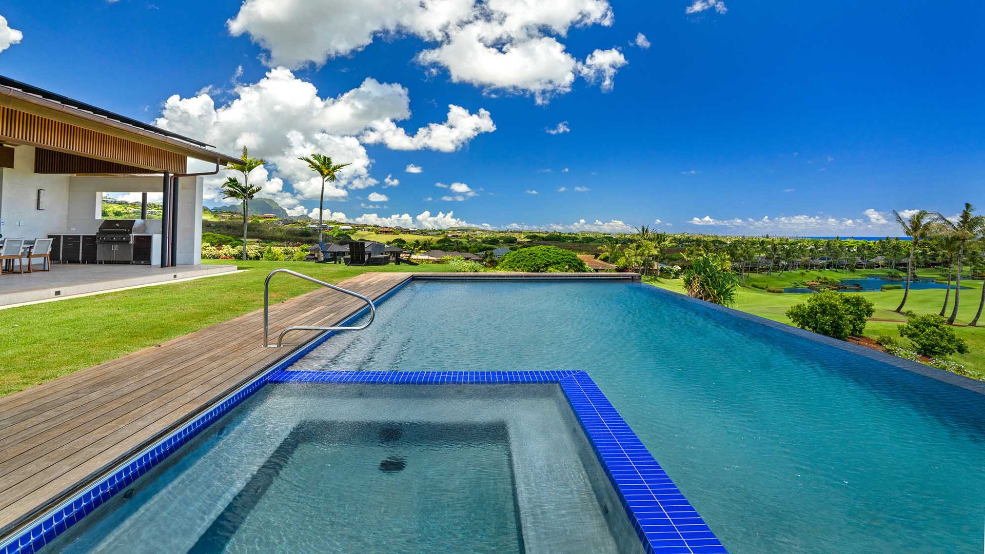 Step out to your private oasis where crystal-clear waters meet endless island views. Sink into the built-in lounger, cool off in the infinity pool, and soak up pure tropical paradise under brilliant blue skies.