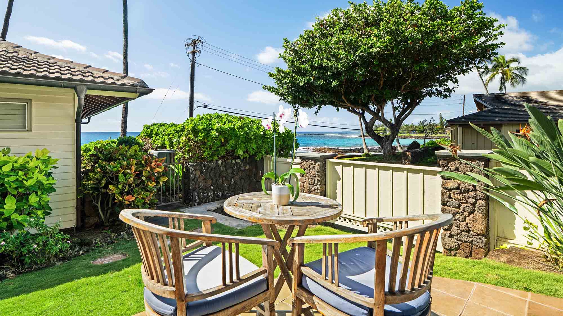 Sip your morning coffee at this charming outdoor dining set, where ocean breezes and stunning sea views create the perfect backdrop for your island getaway.