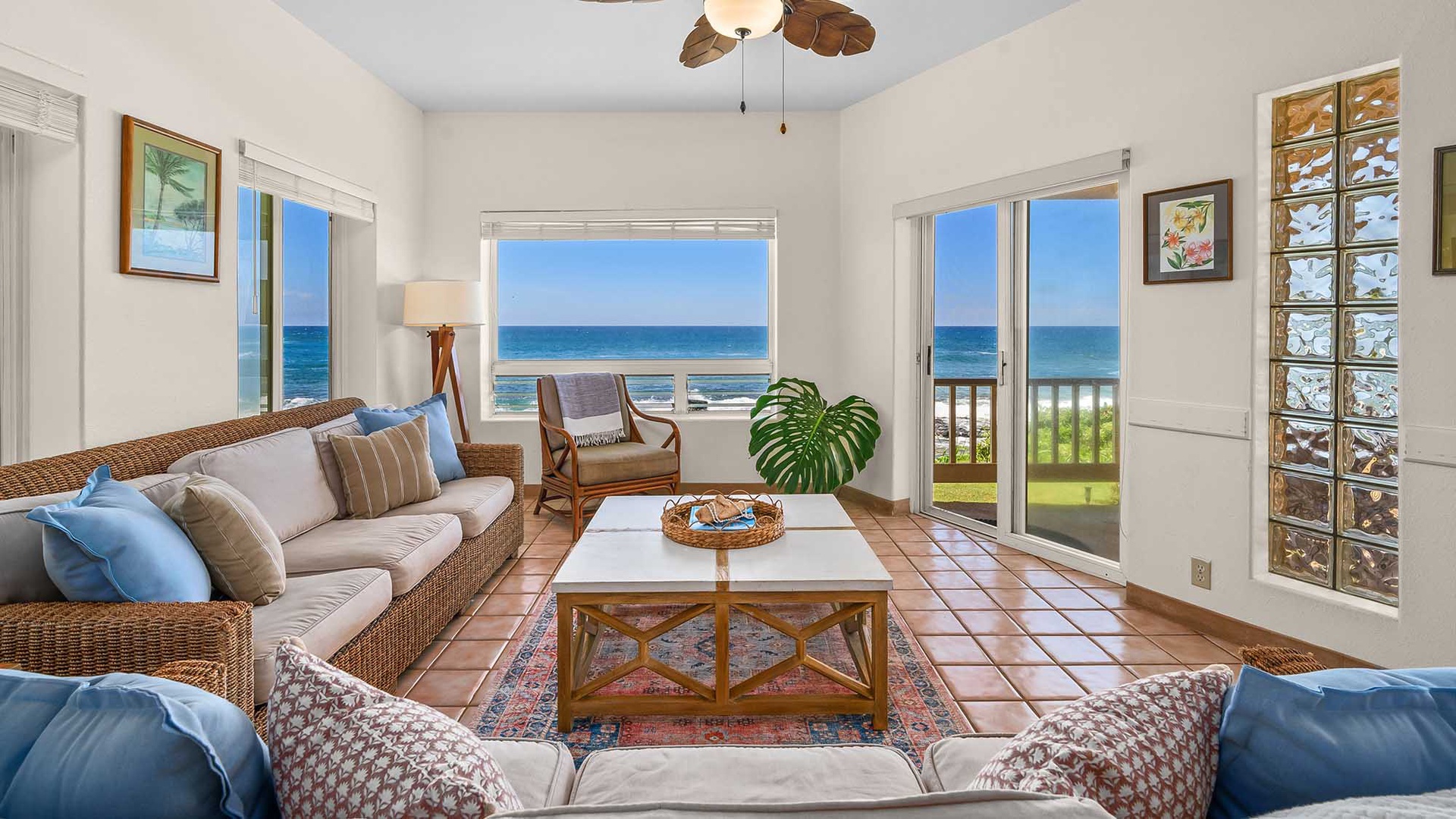 Settle into this bright, coastal living room where the ocean stretches endlessly beyond your glass doors. Feel the breeze from your private balcony as you unwind on plush seating with stunning sea views.