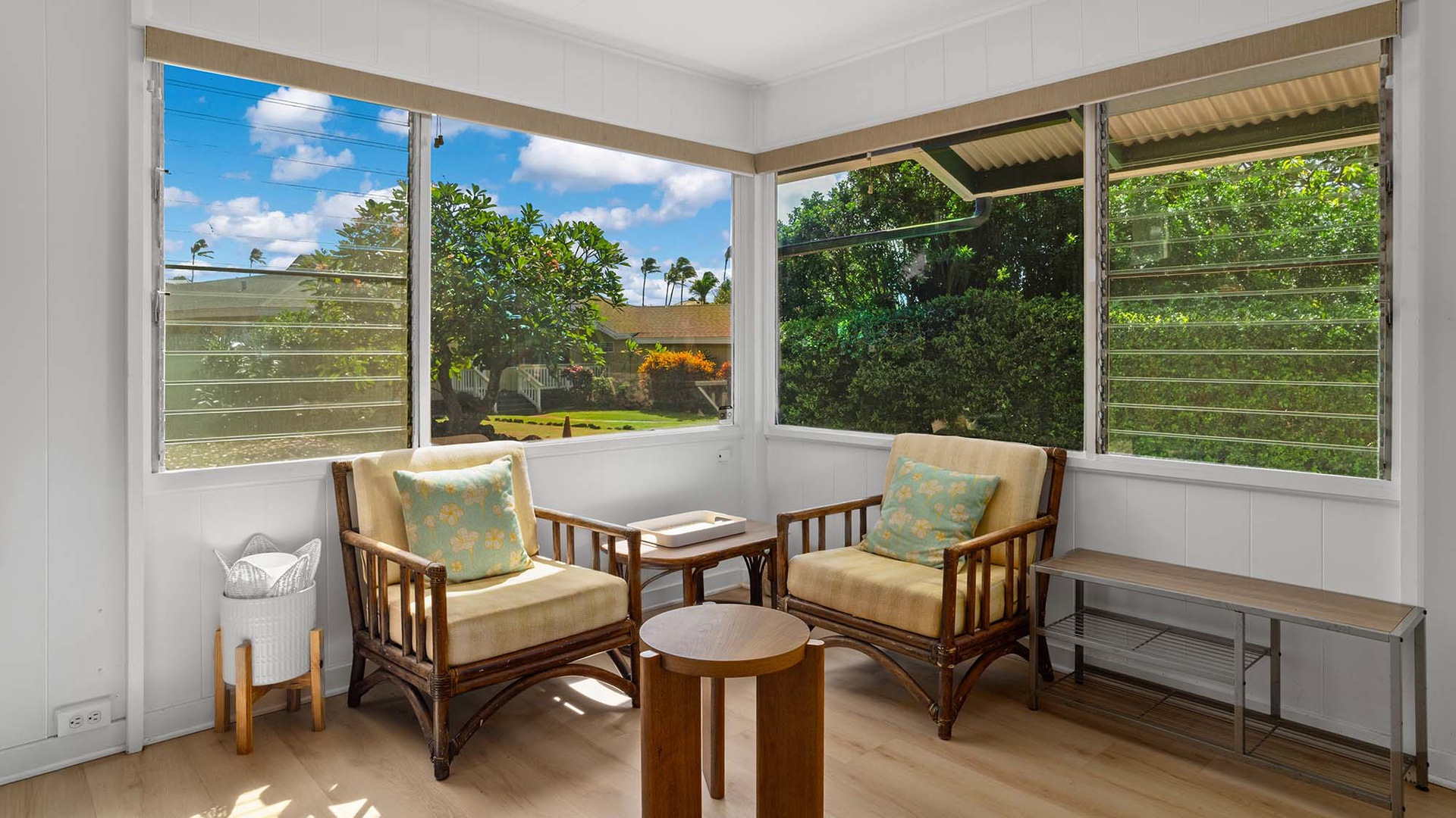 Settle into your own peaceful corner where light floods through open windows and tropical breezes drift in. Lush greenery frames your view of swaying palms and island skies.