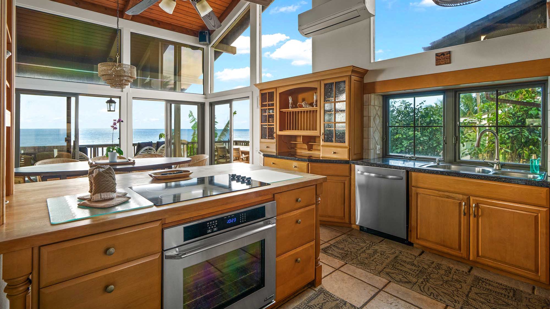 Cook with breathtaking ocean views through expansive windows that flood your kitchen with natural light and coastal charm.