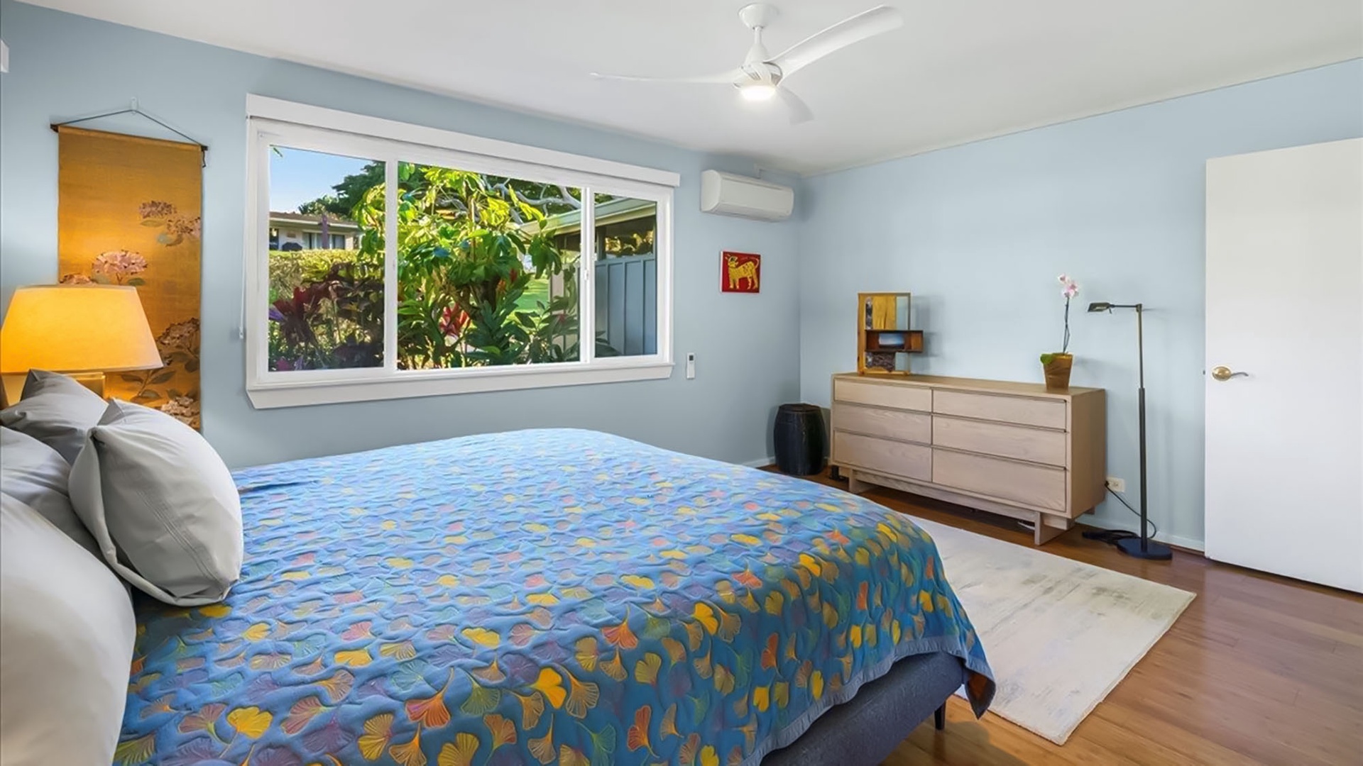 Wake up refreshed in your serene bedroom with tropical garden views and modern comforts like air conditioning keeping you cool.