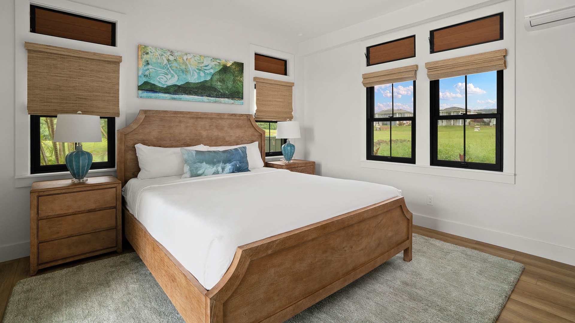 Drift off to sleep in your comfortable bedroom overlooking peaceful green fields through elegant windows.