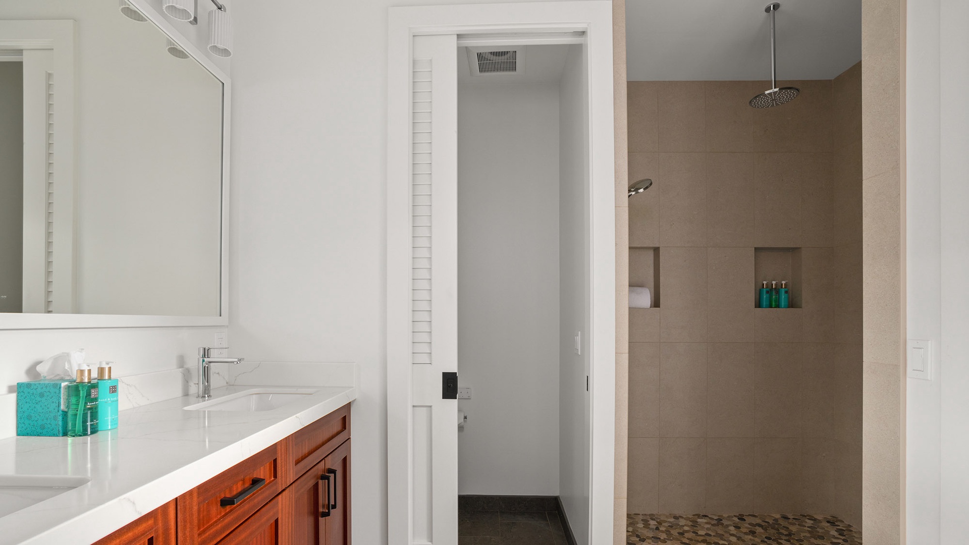Refresh in your sleek bathroom with a spacious walk-in shower and modern vanity, complete with premium amenities for your comfort.