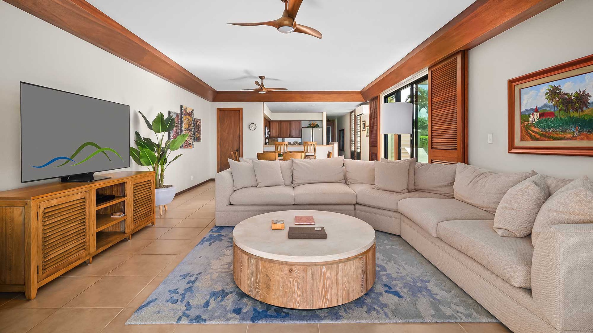 Picture yourself sinking into this plush sectional after a day of island adventures, tropical breezes drifting through open shutters as warm wood tones wrap you in comfort and calm.