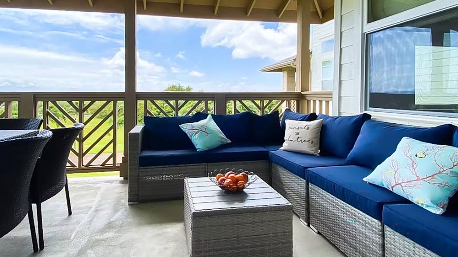 Relax on your covered patio with comfortable seating and enjoy the peaceful greenbelt views stretching beyond the railing.