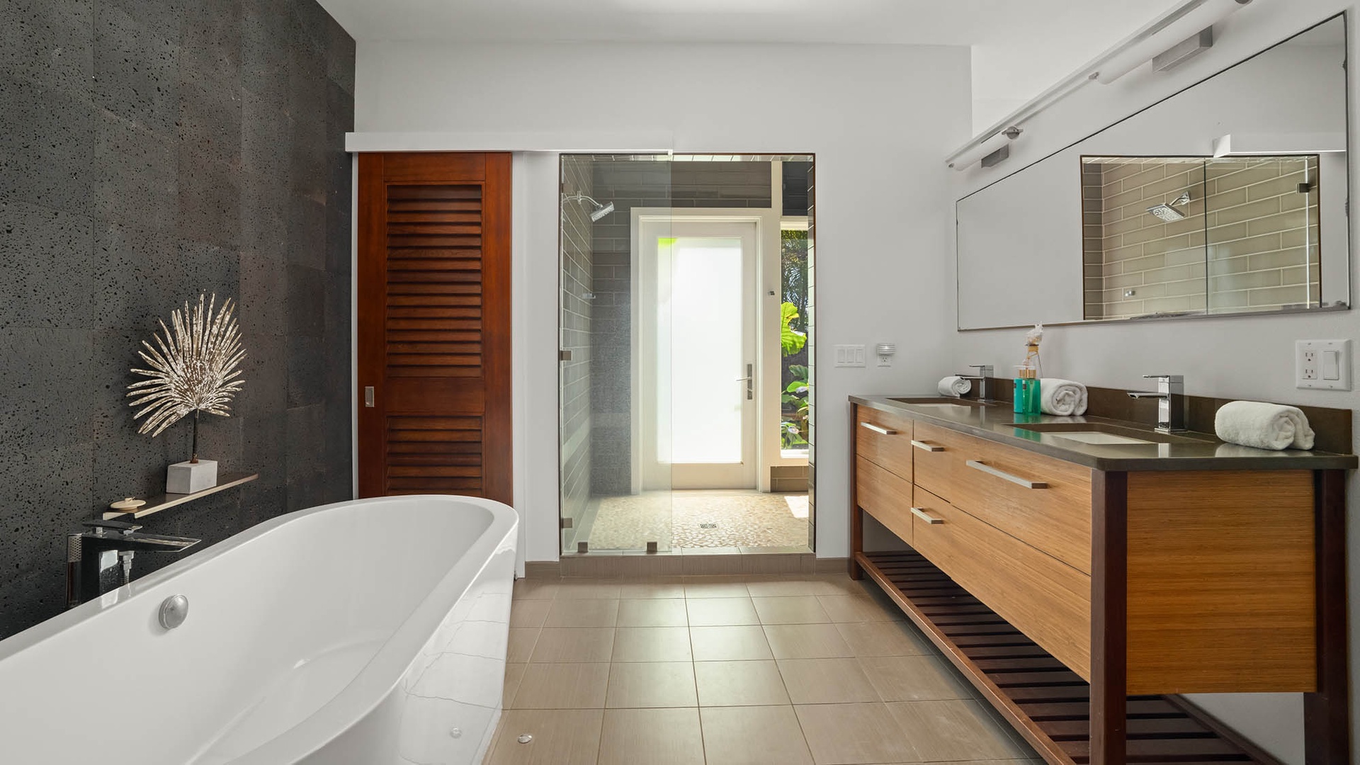Indulge in your private spa-like sanctuary with a deep soaking tub, spacious walk-in shower, and elegant vanity—your peaceful retreat awaits.