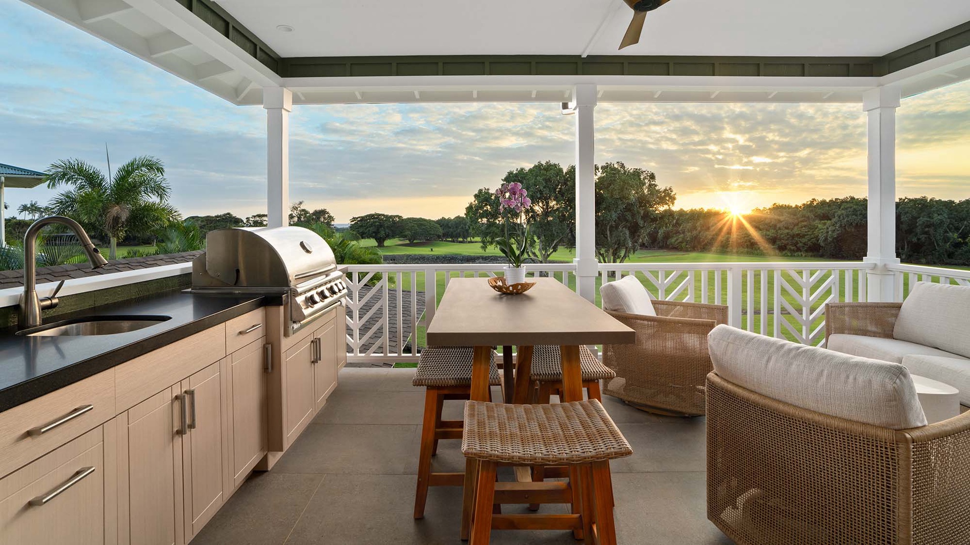 Watch the golden sunset from your private covered terrace while grilling dinner in this elegant outdoor kitchen space.