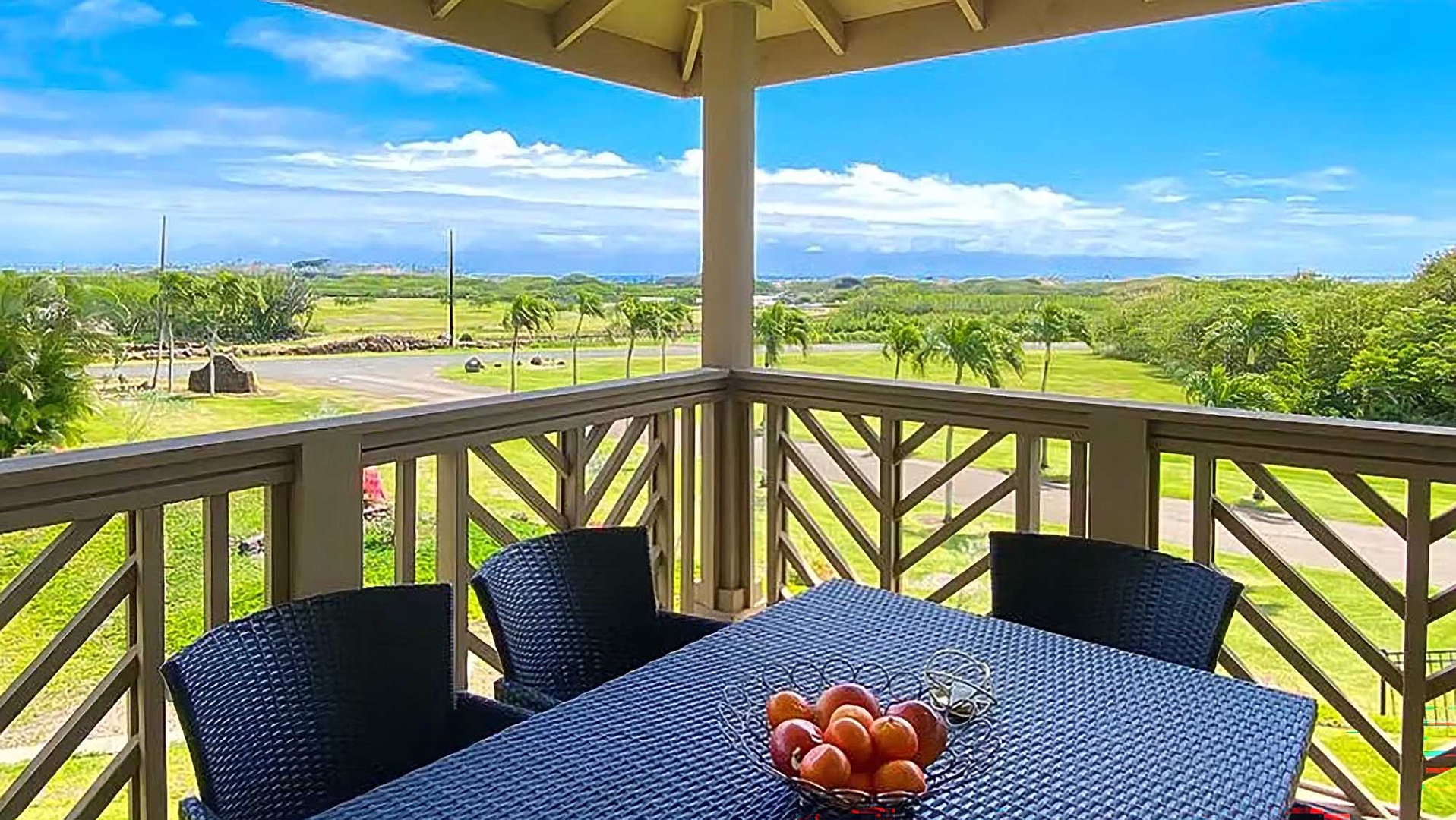 Panoramic vistas stretch before you from this shaded balcony, where lush greens meet distant horizons. Sip your morning coffee at the table as island breezes drift through.