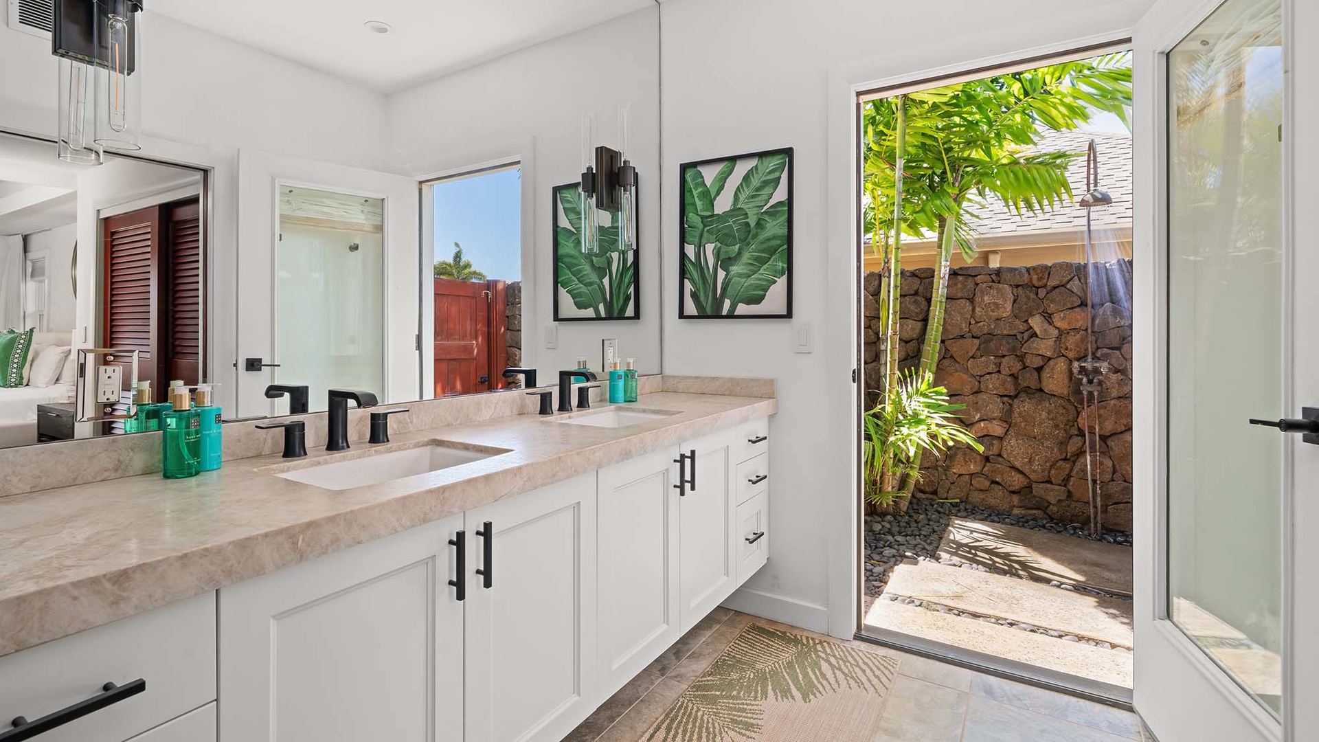 Step into your spa-like bathroom retreat, where tropical breezes and natural light welcome you. The outdoor shower invites pure relaxation under swaying palms and open sky.