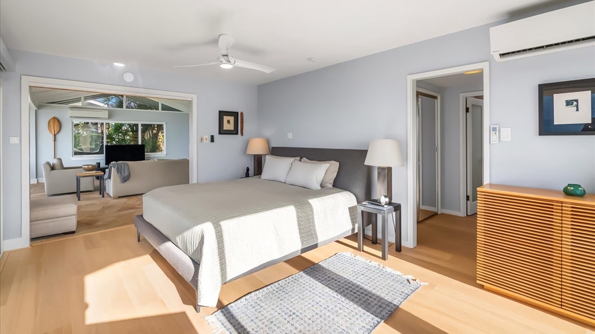 Drift off in your serene master suite with polished floors, gentle ceiling fan breeze, and air conditioning comfort for perfect nights.