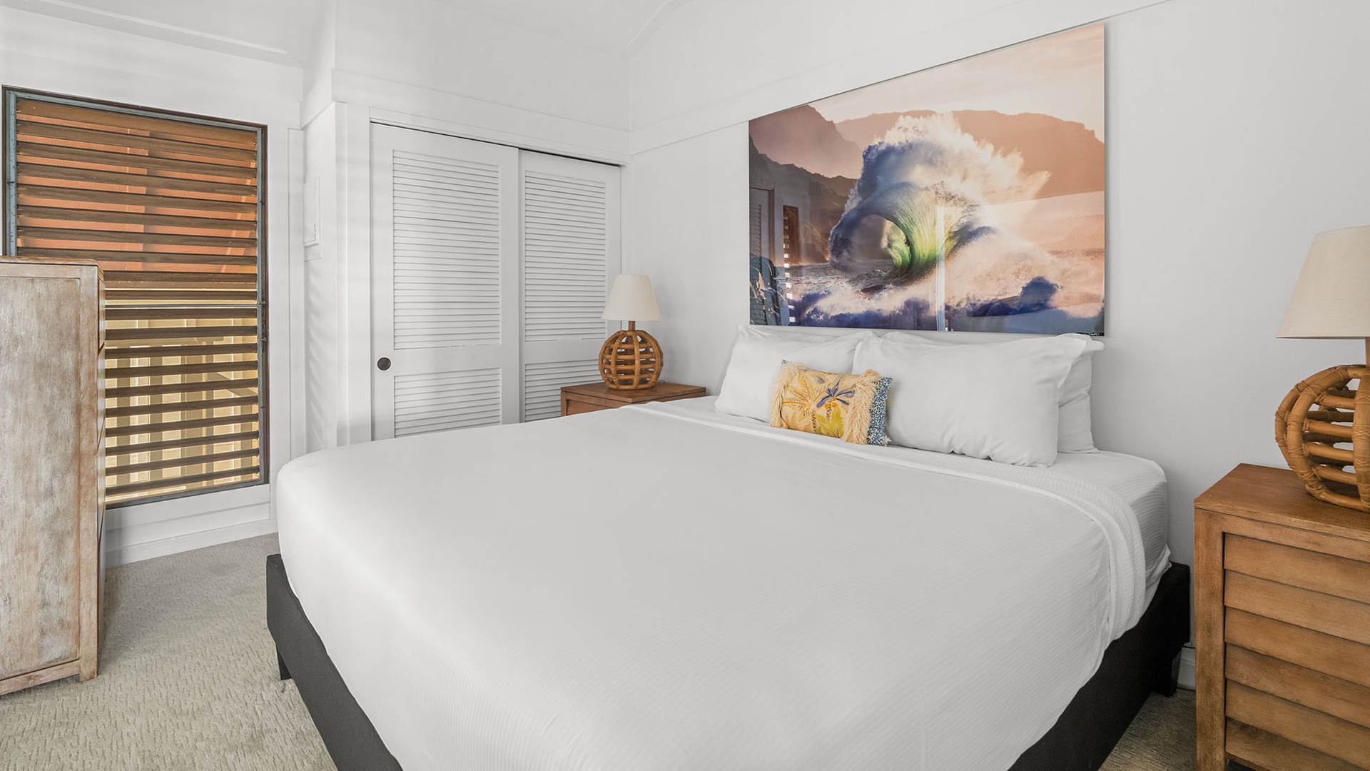 You'll love waking in this serene bedroom with crisp linens, coastal artwork, and warm timber accents inviting total relaxation.