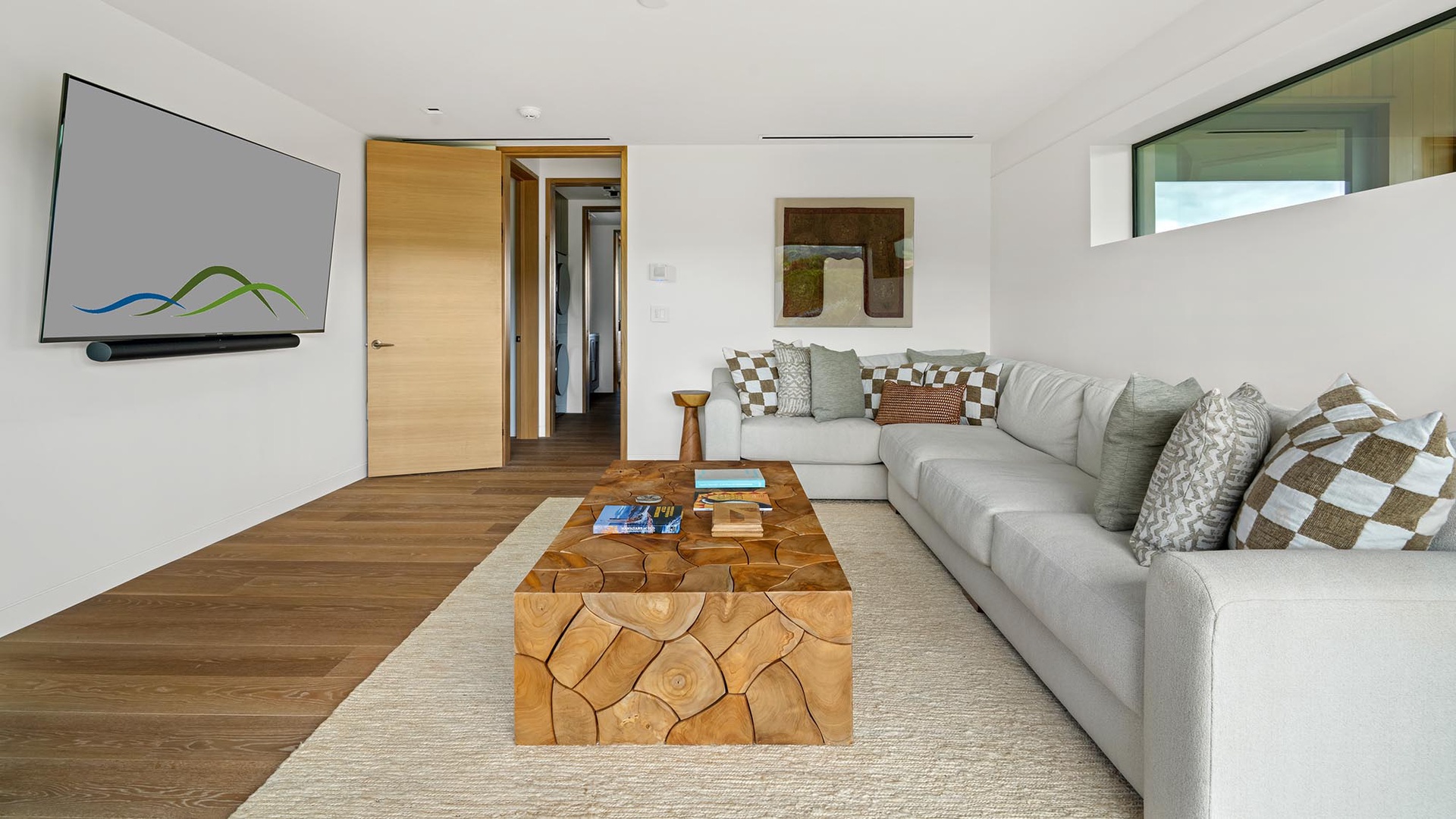 Sink into plush seating and unwind in your bright, airy living space, thoughtfully designed with natural wood touches and soft textures that invite relaxation after a day of adventure.