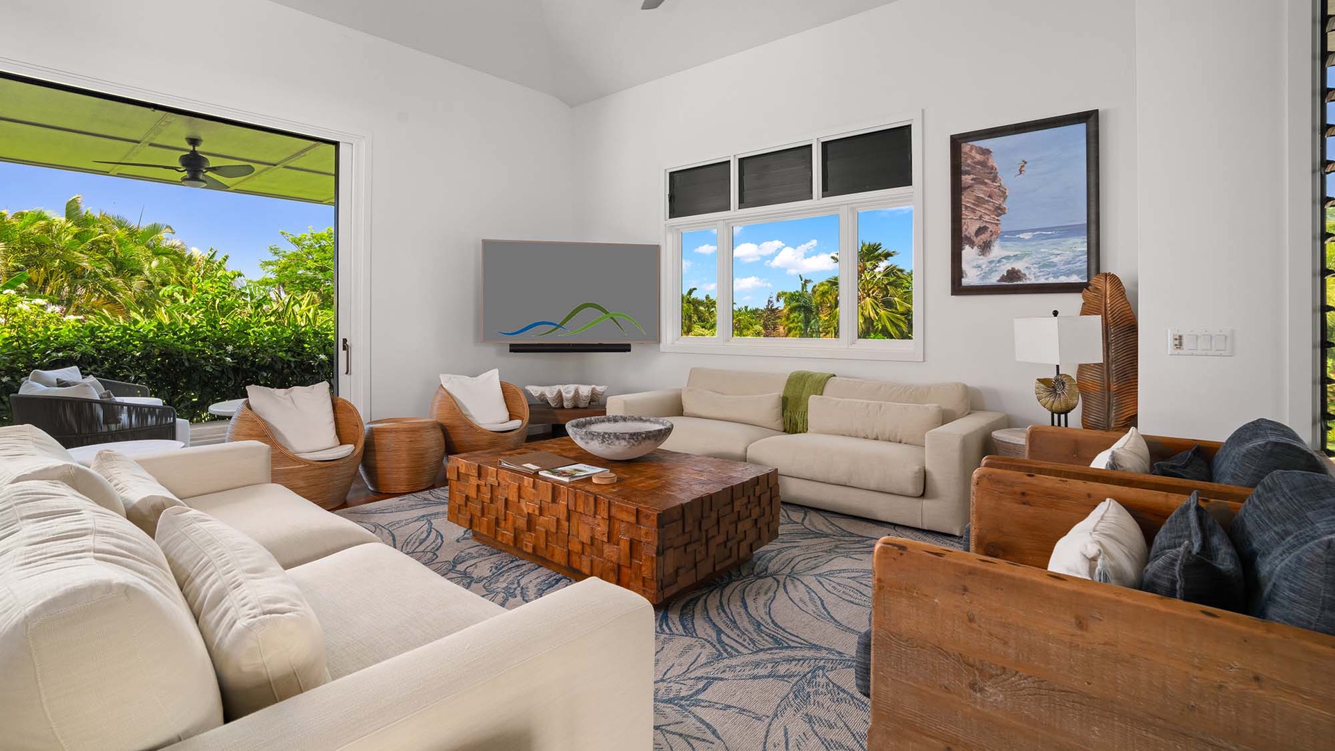 Sink into plush sofas and soak up lush tropical views through picture windows. Your private oasis awaits with coastal-inspired décor and breezy indoor-outdoor living.