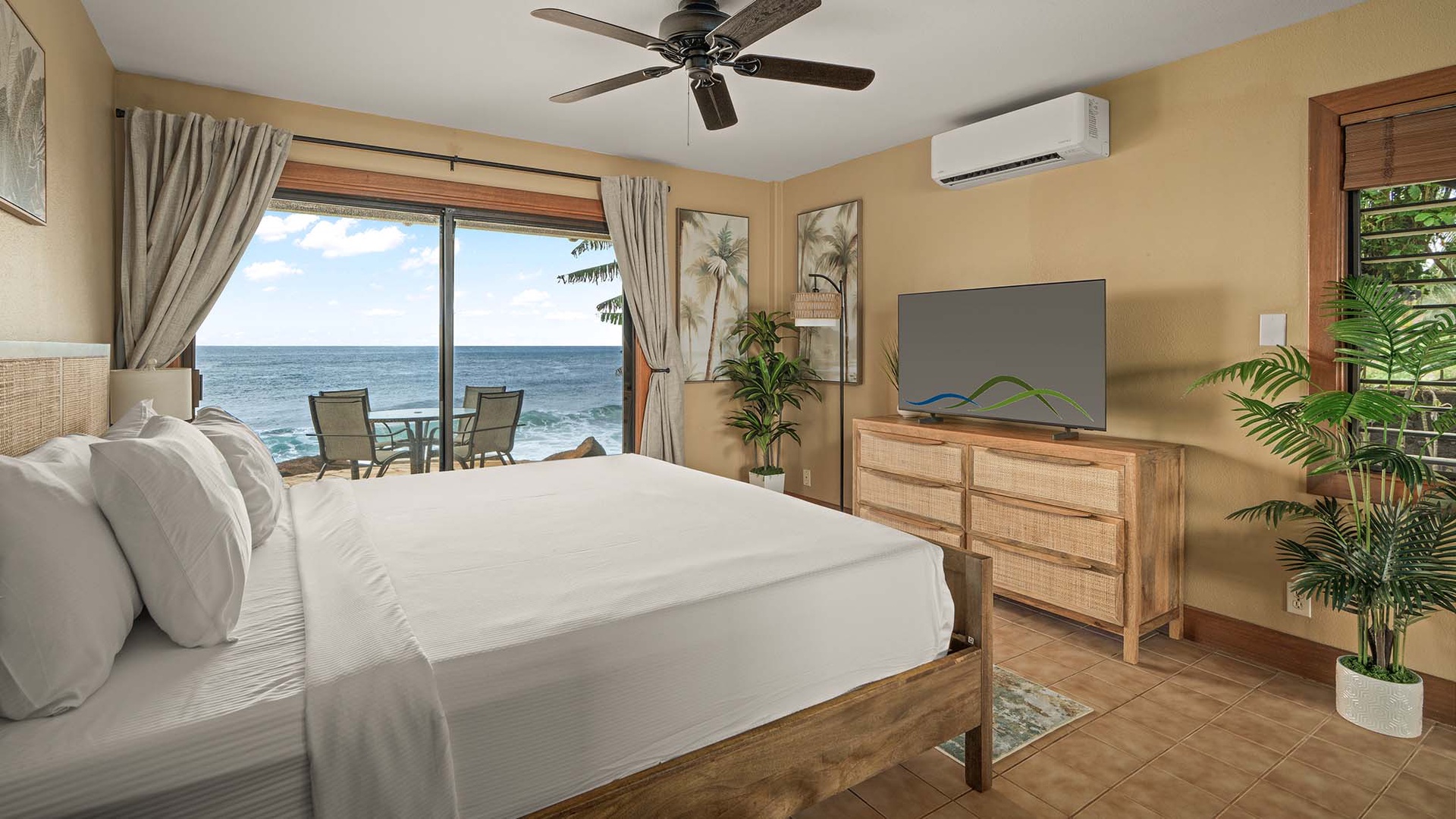 Wake up to stunning ocean views from your bed, with waves gently crashing just outside your window in this tropical paradise.