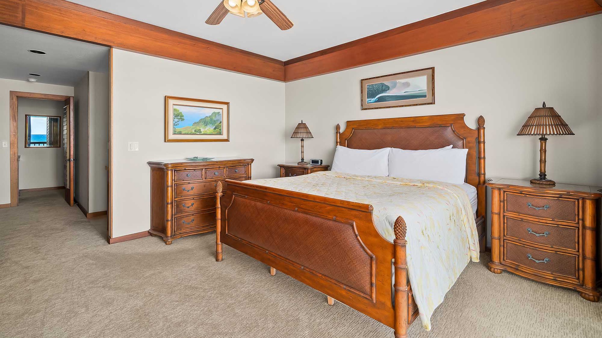 Sink into the plush comfort of your island-style bedroom, where warm wood tones and soft linens invite restful nights after days spent exploring paradise.