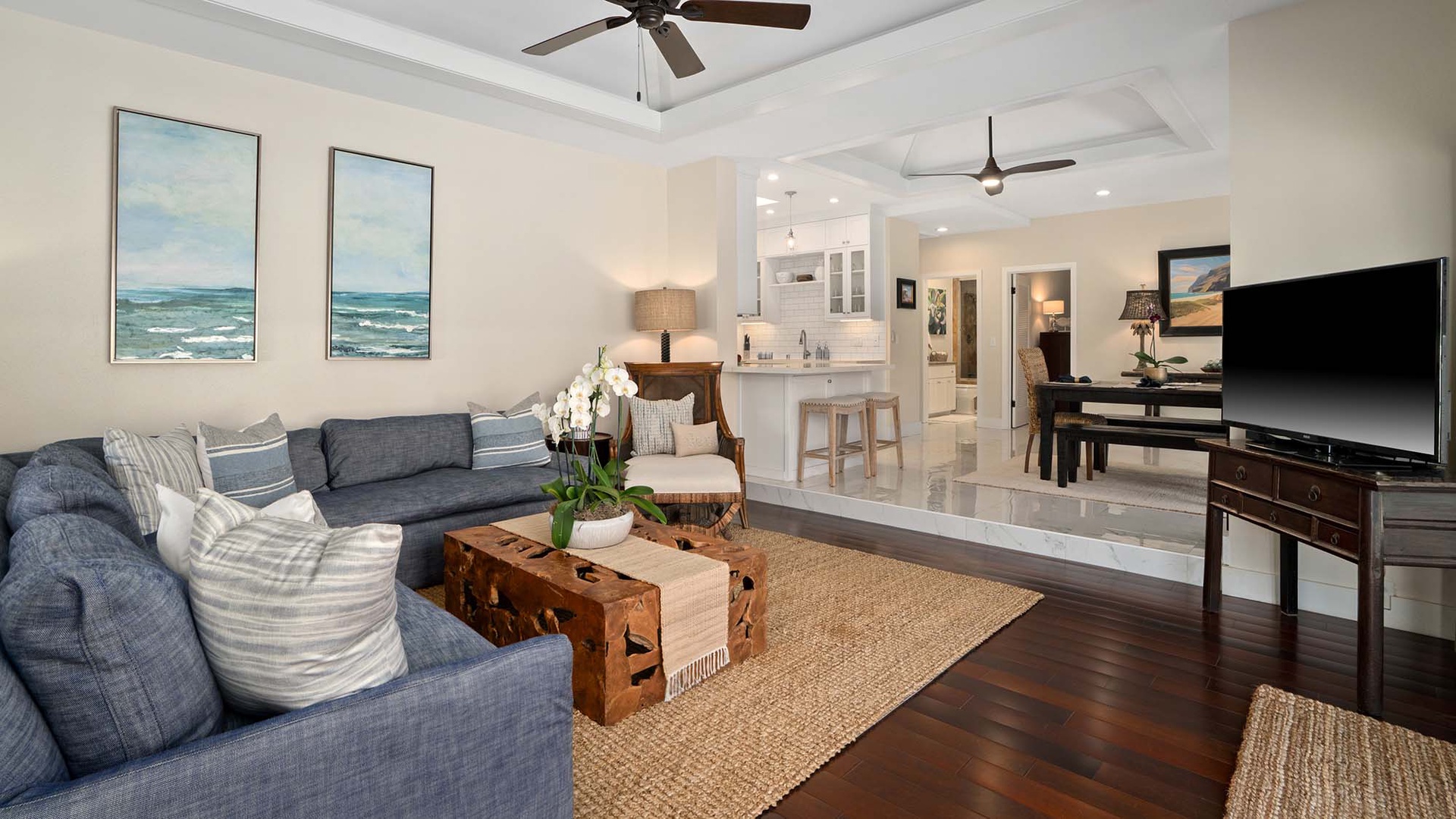 Settle into your coastal-inspired living space where soft blue accents and breezy textures create the perfect retreat after a day of exploring. Modern comfort meets relaxed elegance in this thoughtfully designed open-concept area.