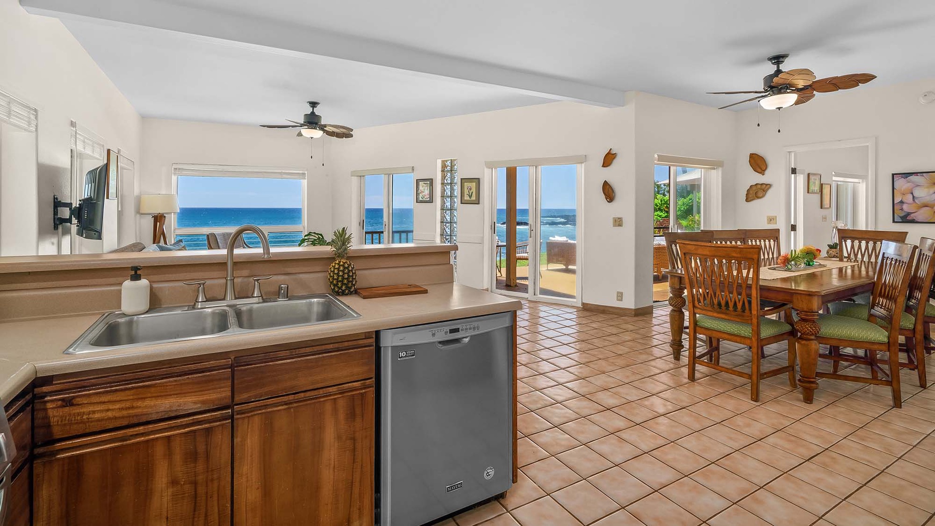 Picture yourself preparing meals in this open kitchen while the ocean stretches across the horizon before you. Step through the glass doors to your private terrace, where island breezes and endless blue water create your perfect Hawaiian escape.