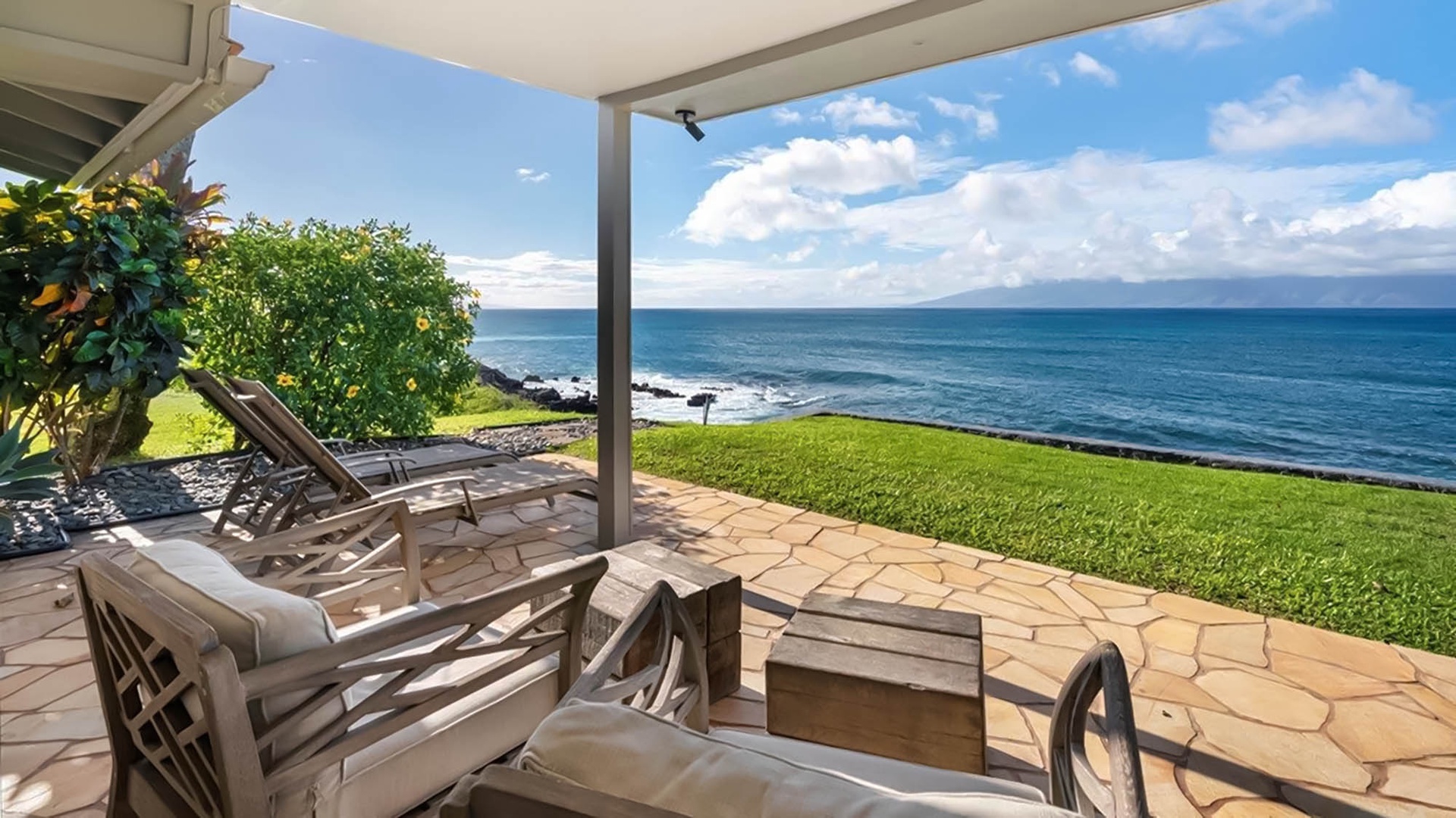Unwind on your private oceanfront patio with stunning sea views stretching to the horizon.