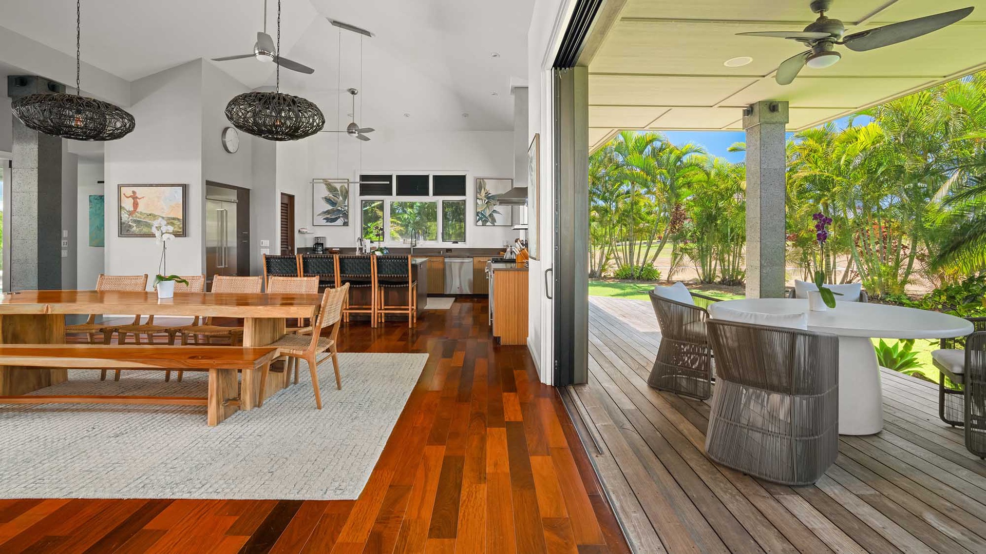 Step into your bright, open living space with warm wood floors, stylish furnishings, and seamless indoor-outdoor flow. Your private terrace and lush garden await just outside the sliding doors.