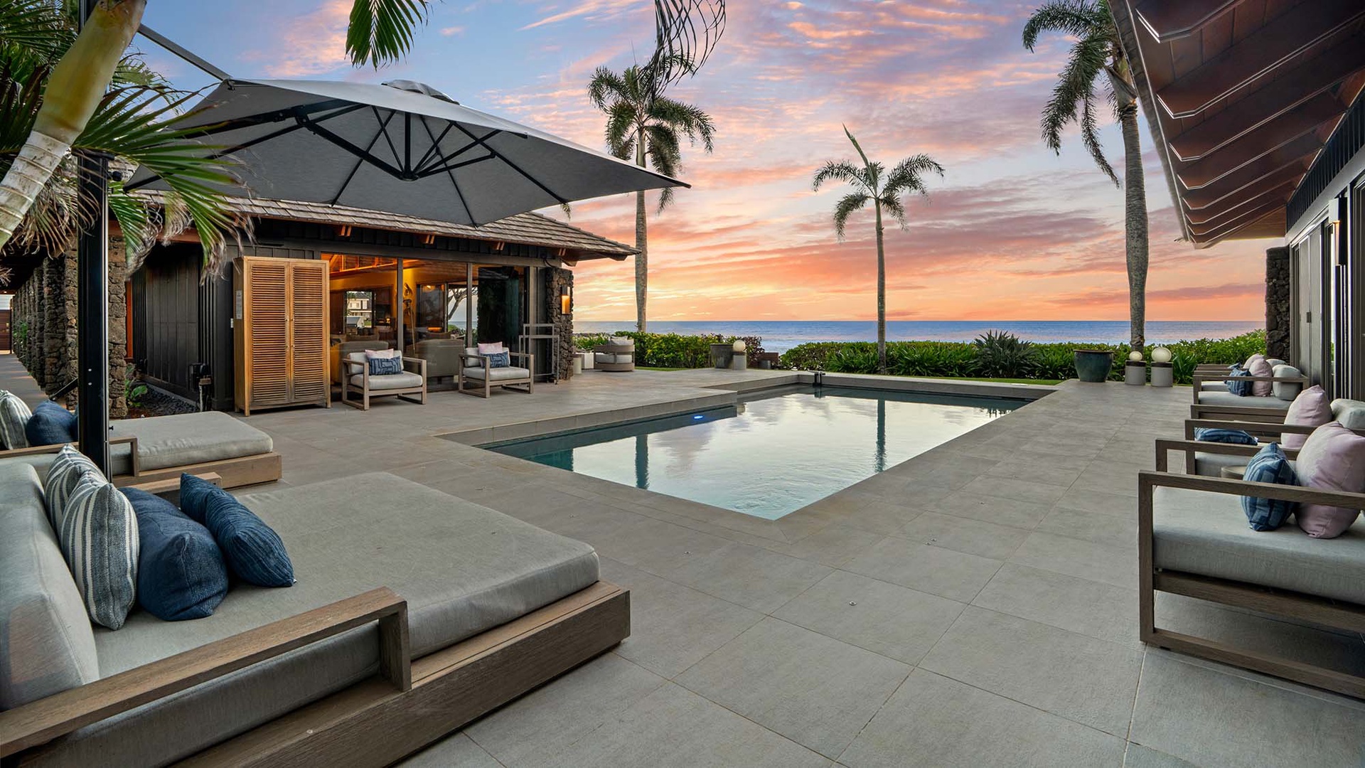 Luxury oceanfront villa with private pool and sunset views creates the perfect tropical escape.