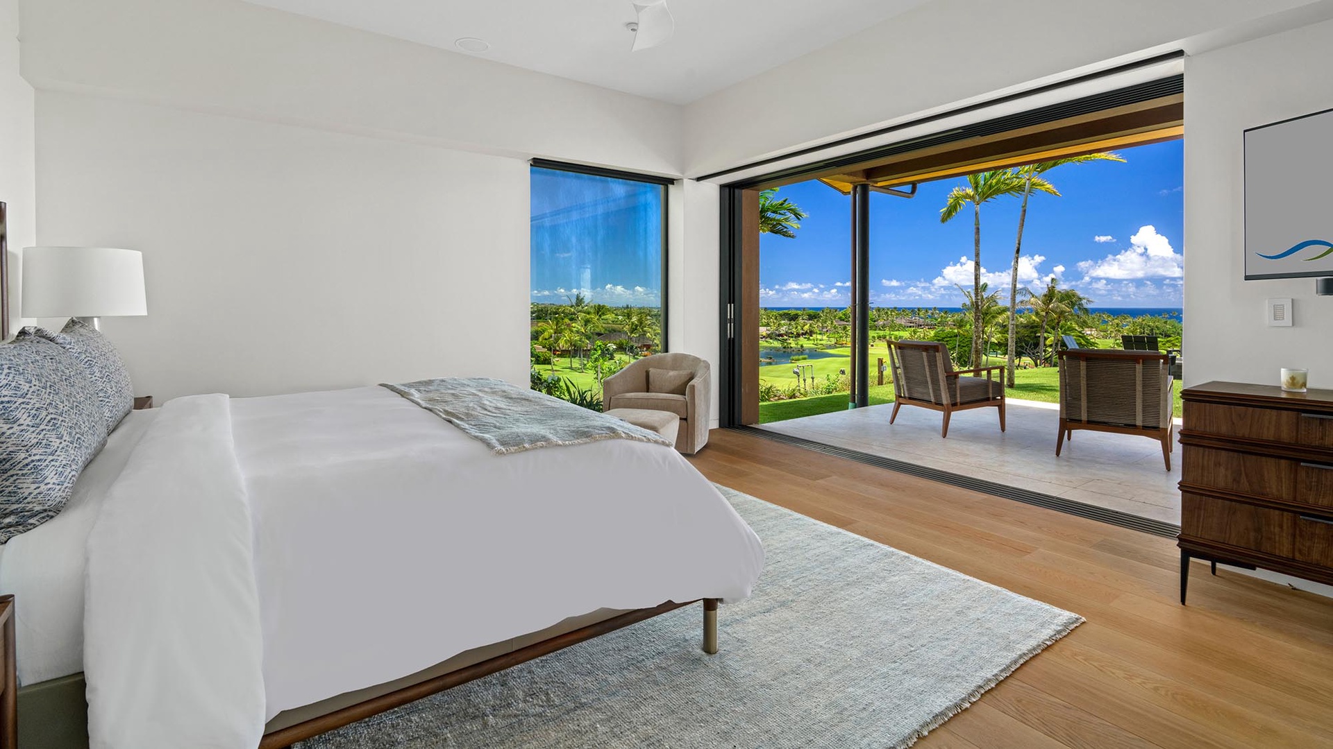 Wake up to stunning views of swaying palms and lush green fairways. Your bedroom opens to a private balcony where morning coffee feels like paradise.