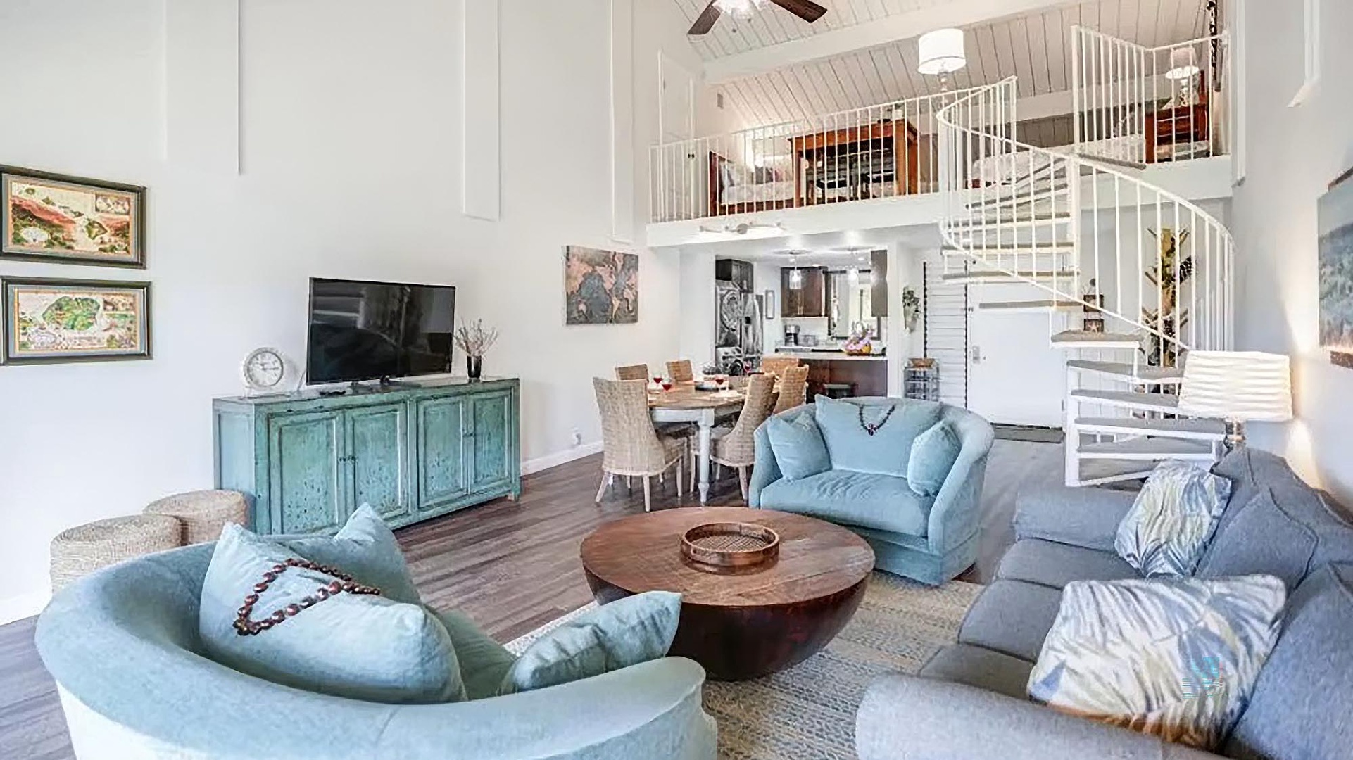 Step into your light-filled retreat where vaulted ceilings and an elegant spiral staircase create an airy, open space perfect for unwinding after a day of adventure.