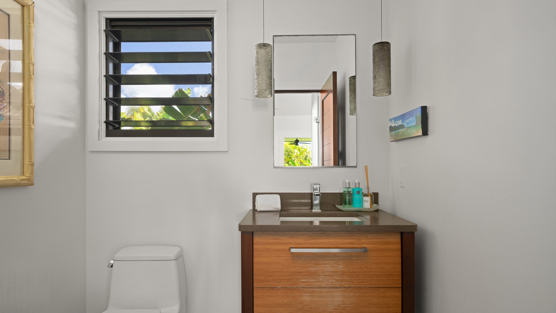 Freshen up in your modern bathroom, where soft natural light and clean lines create a serene retreat after a day of exploring.