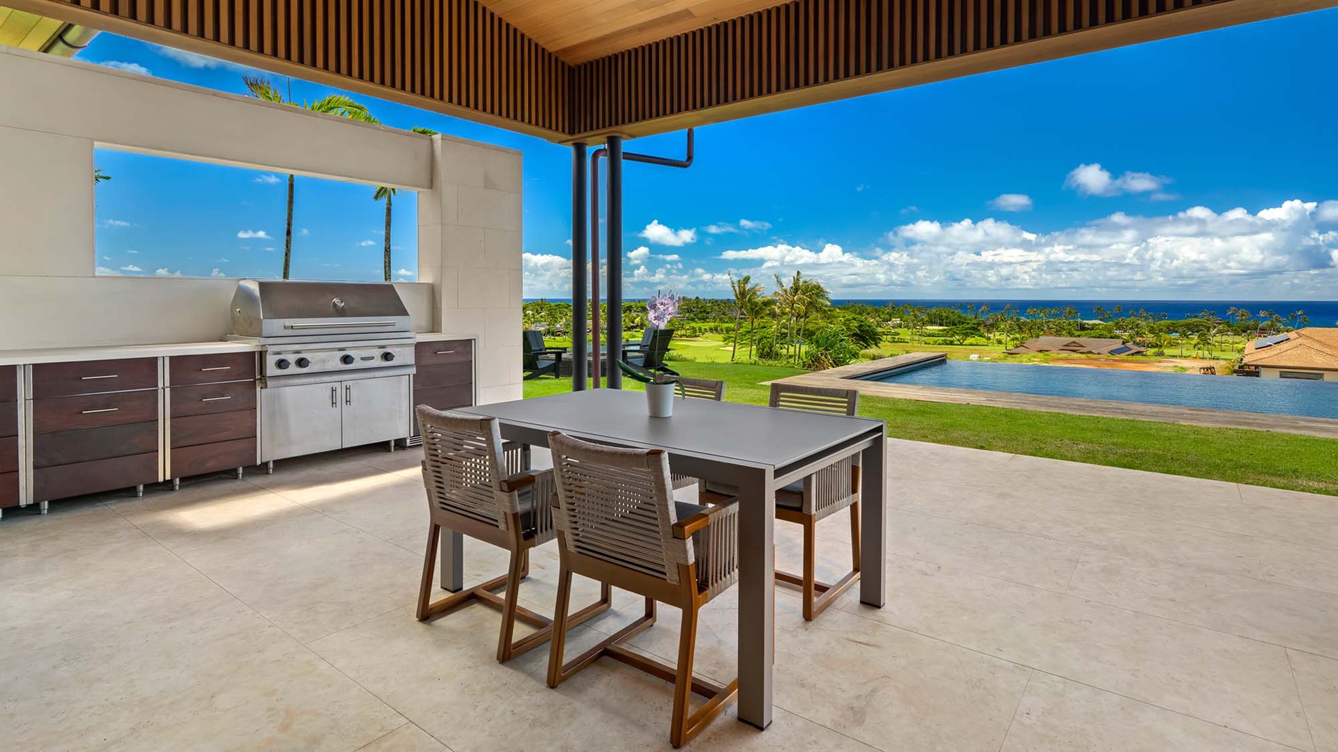 Grill up island flavors in your covered outdoor kitchen while soaking in sweeping ocean and pool views. Dine al fresco under tropical skies—your perfect Hawaiian escape awaits.