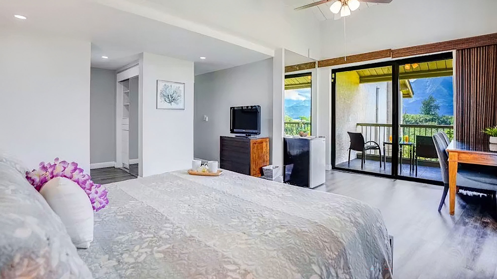 Step into your restful retreat with a balcony opening to breathtaking mountain views and cooling breezes. Bright, airy, and thoughtfully designed to help you unwind.