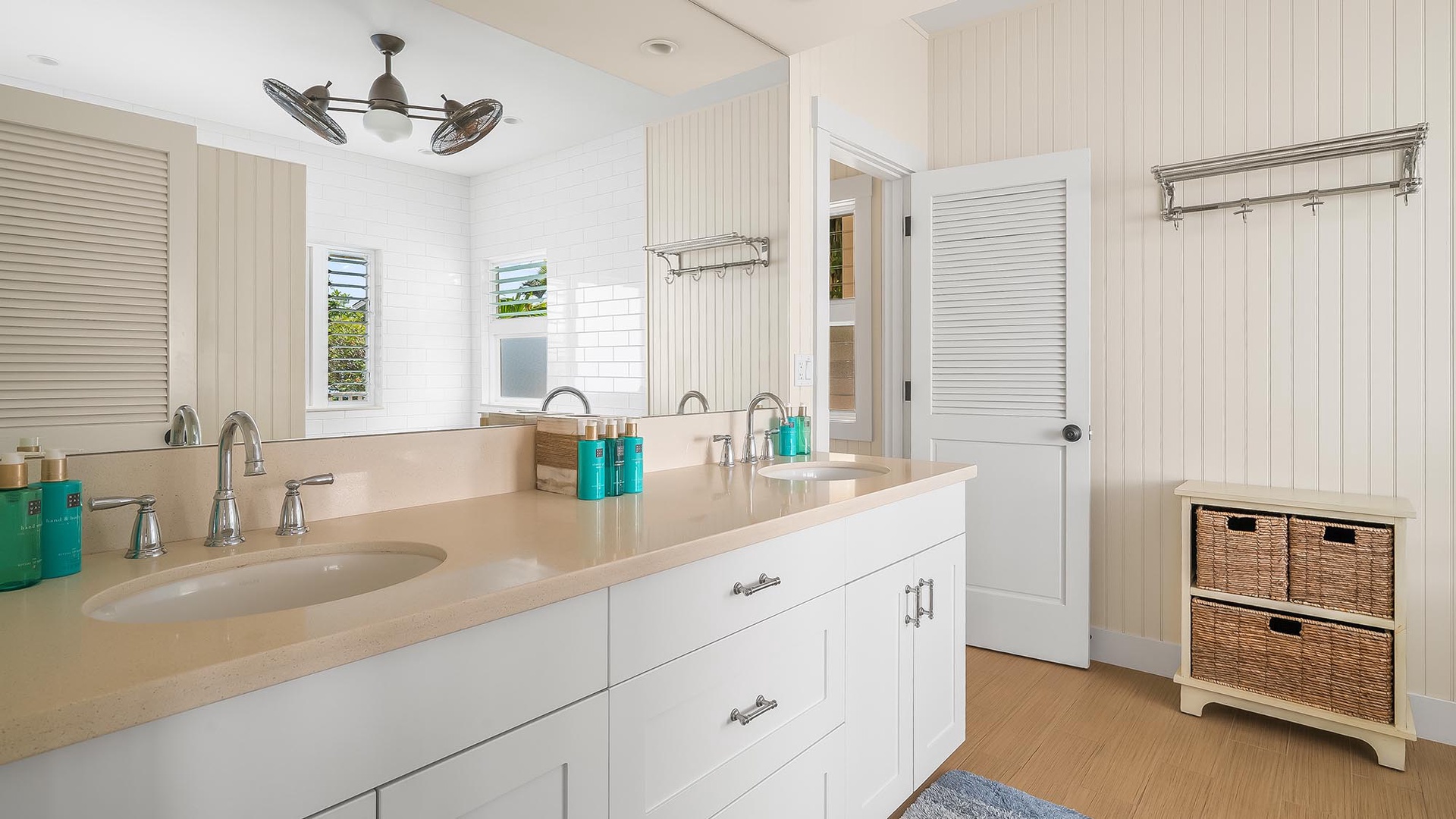 Refresh in this bright, coastal-inspired bathroom with dual sinks, generous counter space, and thoughtful storage that makes your morning routine feel effortless and serene.