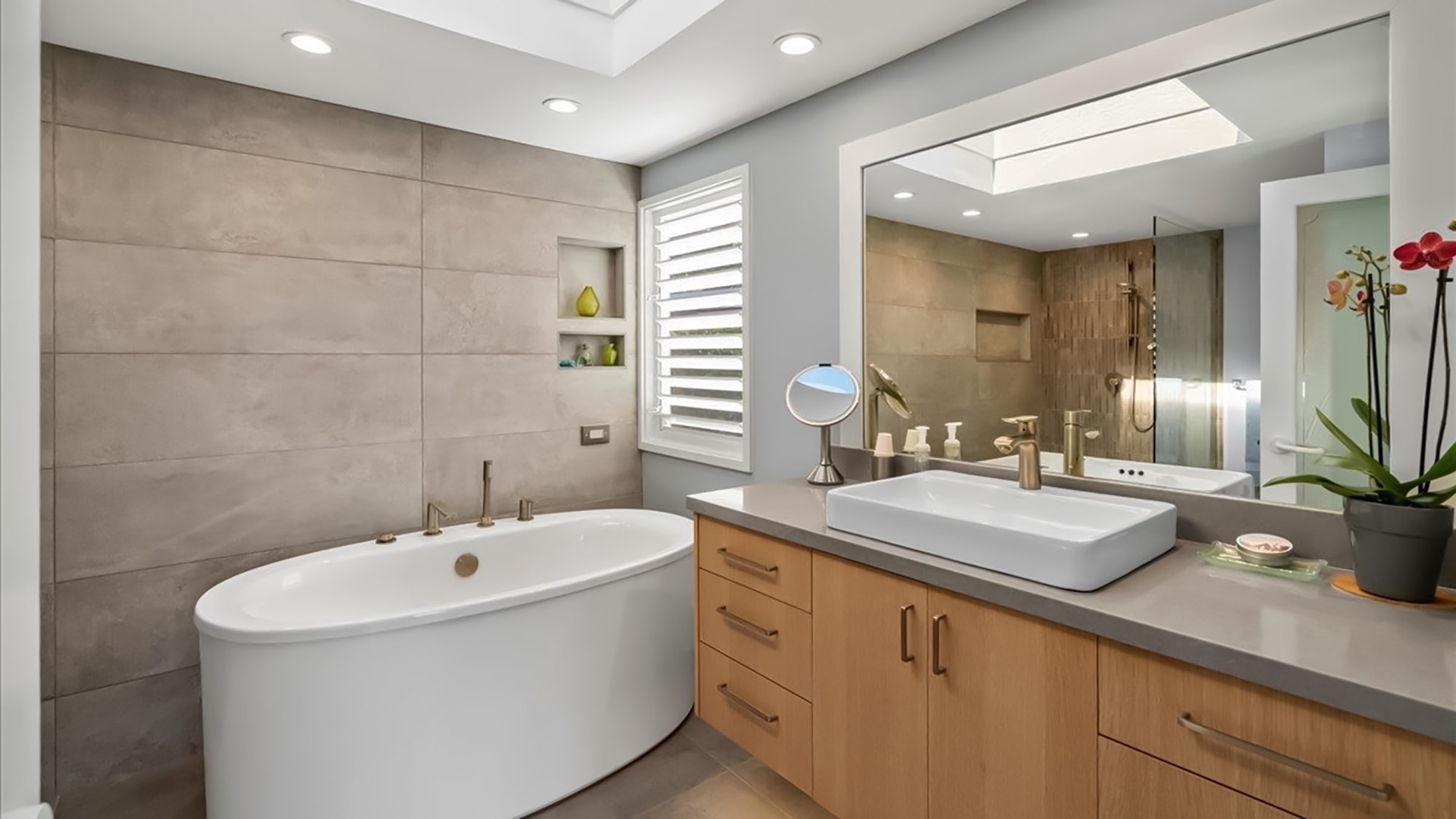 Soak away your stress in this luxurious spa-like bathroom with soaking tub, modern vanity, and elegant finishes.