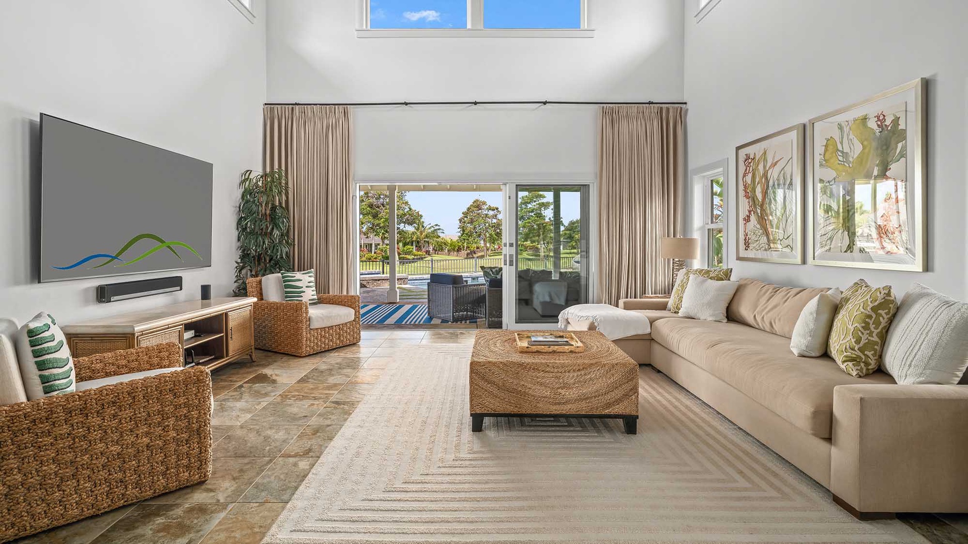 Relax in your spacious living room where soaring ceilings and sunlit windows frame lush outdoor views. Sink into the plush sofa, unwind with your favorite show, and feel right at home in this bright, airy retreat.