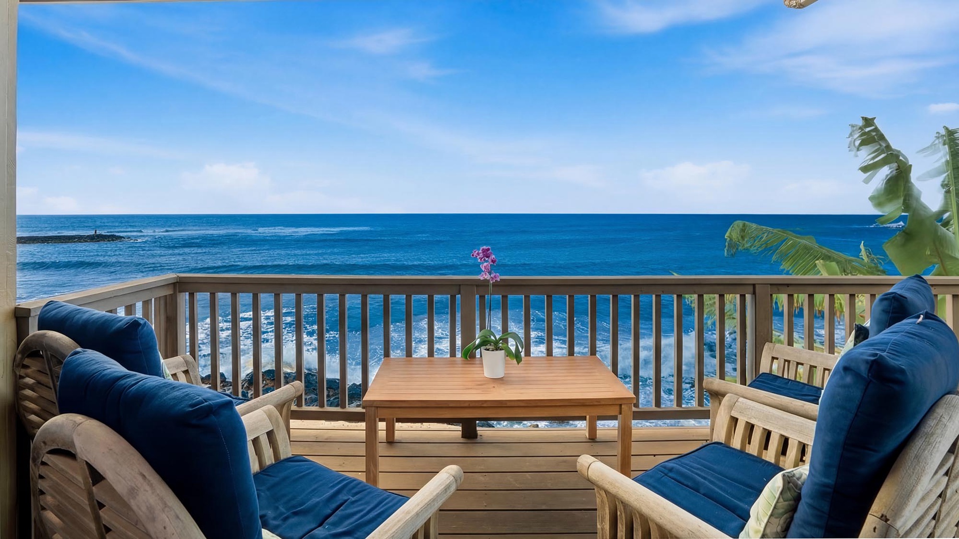 Unwind on your private oceanfront balcony with plush seating and endless blue horizon views.