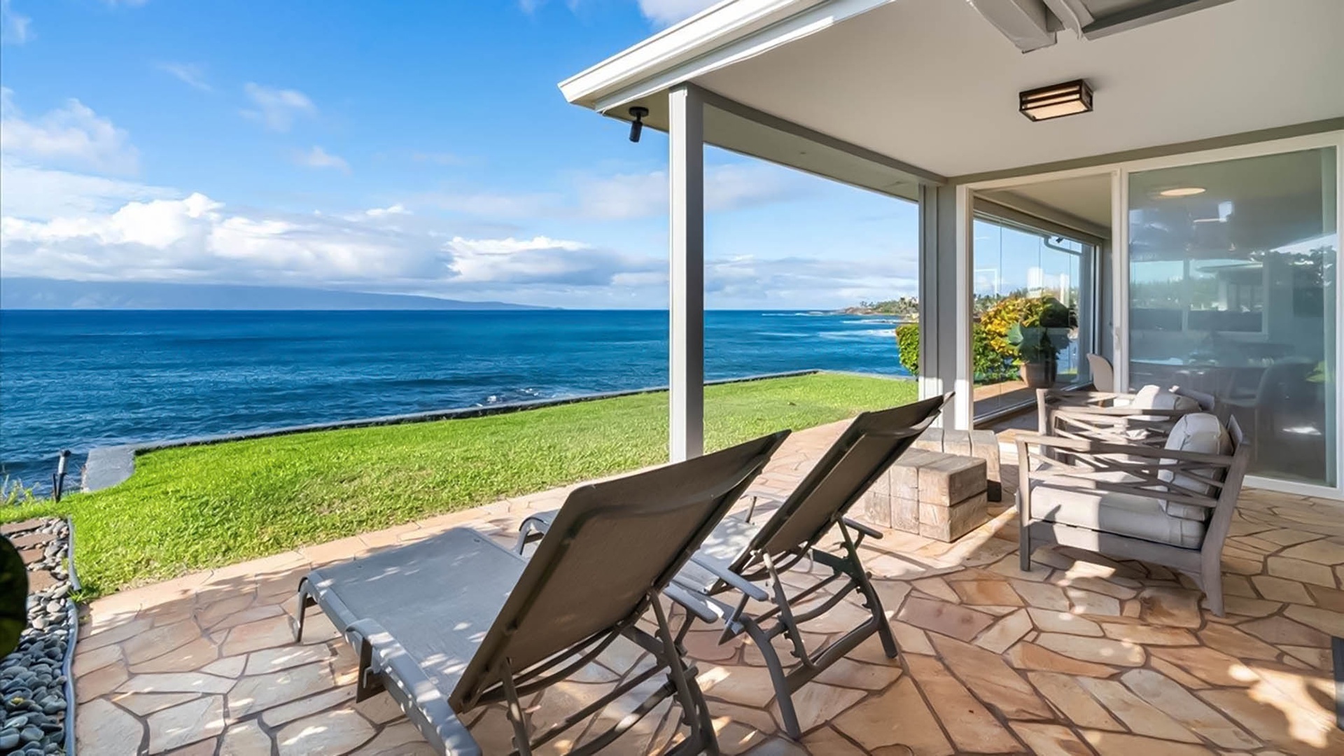 Wake up to endless ocean views from your private covered terrace, where comfortable loungers and seating await your morning coffee ritual.