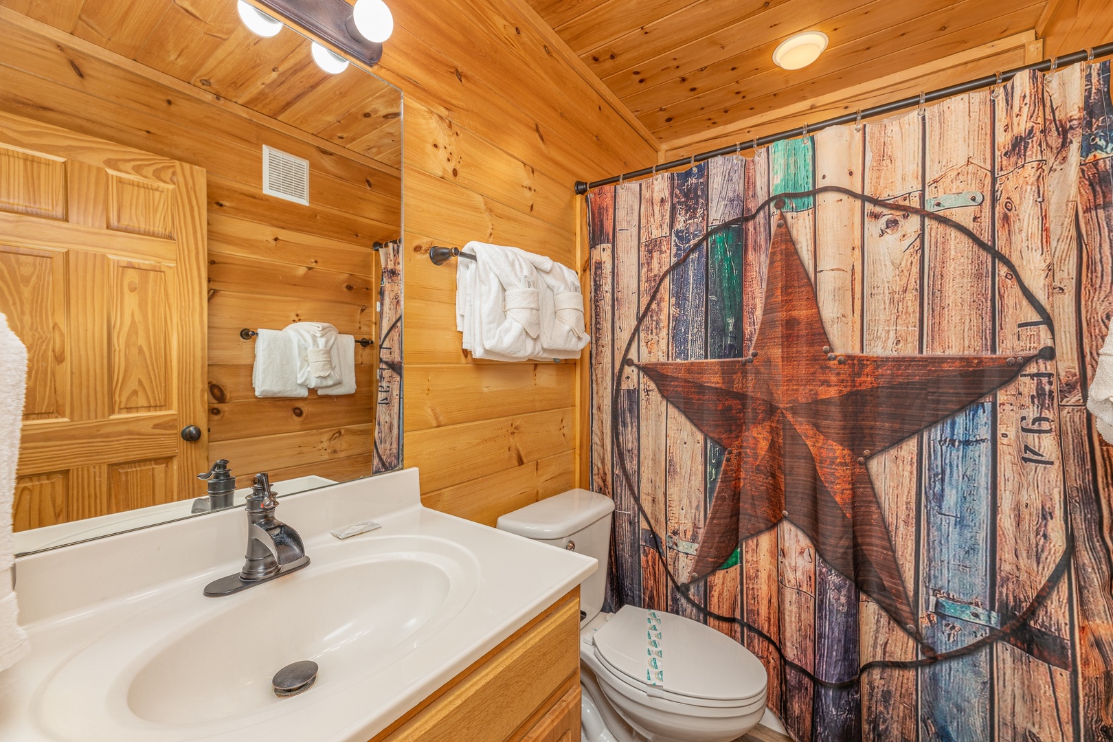 Bathroom with tub and shower at Loving Every Minute, a 5 bedroom cabin rental located in Pigeon Forge