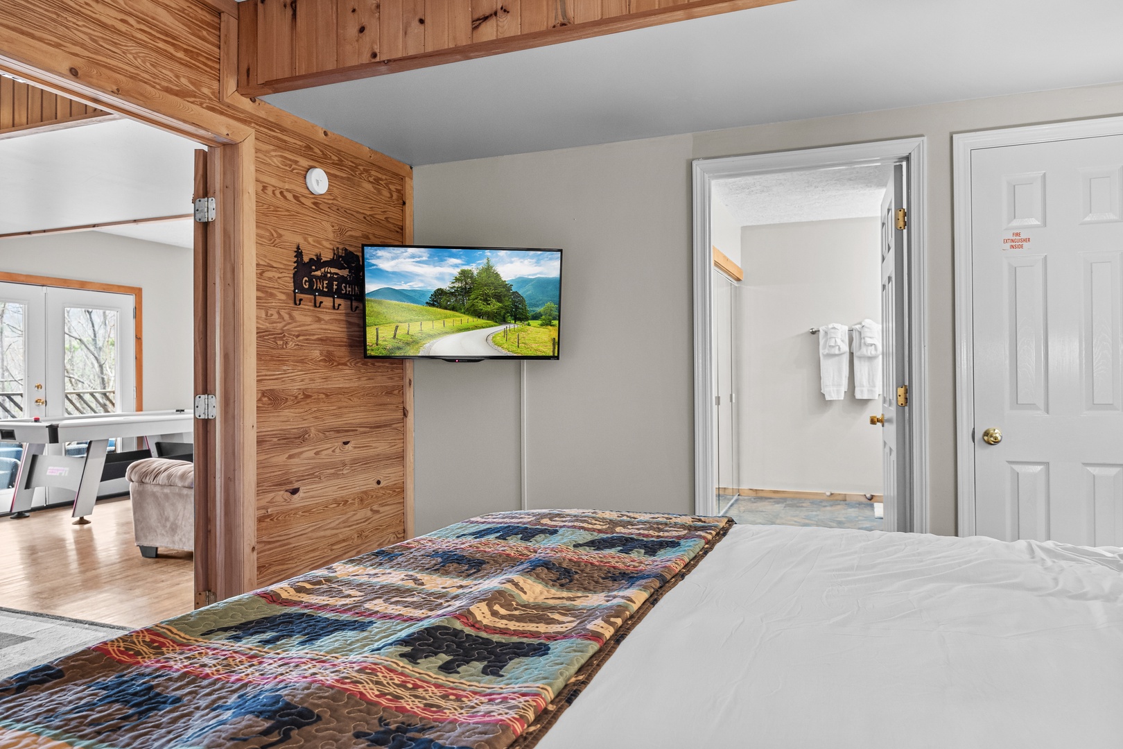 Main floor bedroom TV at Brink of Heaven, a 2 bedroom cabin rental located in Gatlinburg