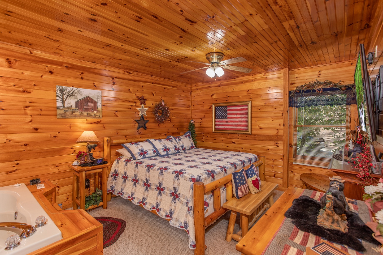 Bedroom with a king-sized log bed at Bear Country, a 3-bedroom cabin rental located in Pigeon Forge