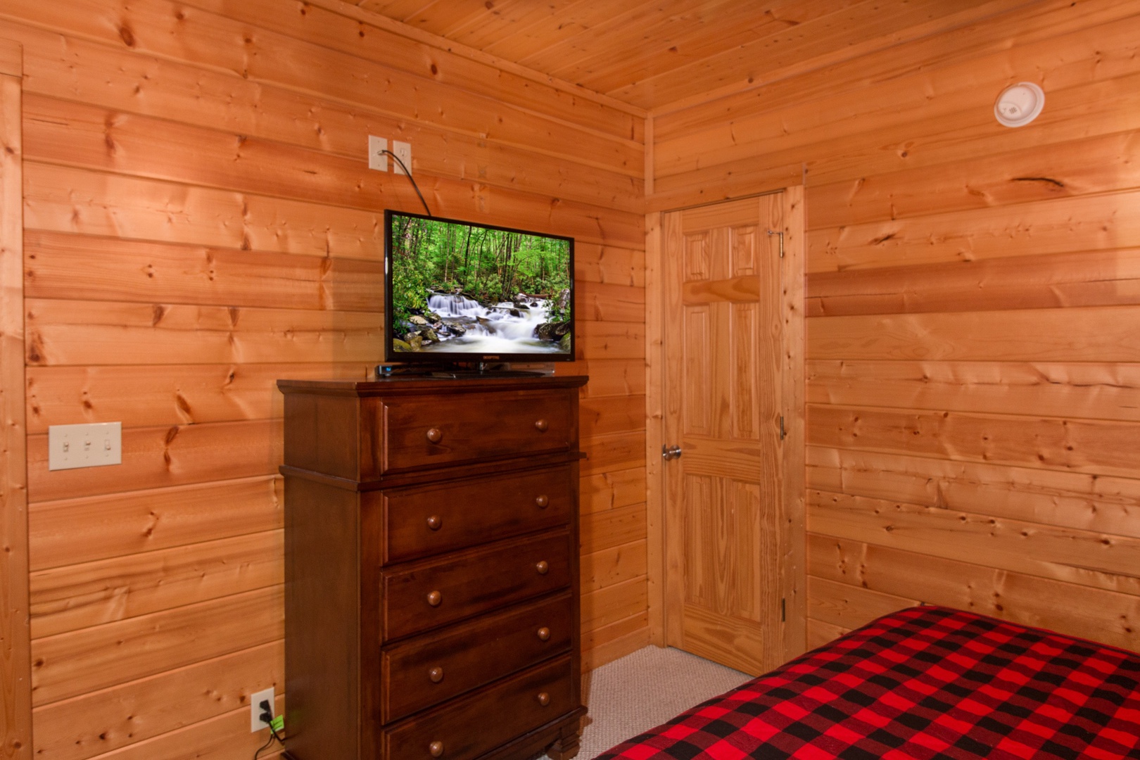 Bedroom Flat Screen at Family Ties Lodge, a 4 bedroom cabin rental located in pigeon forge