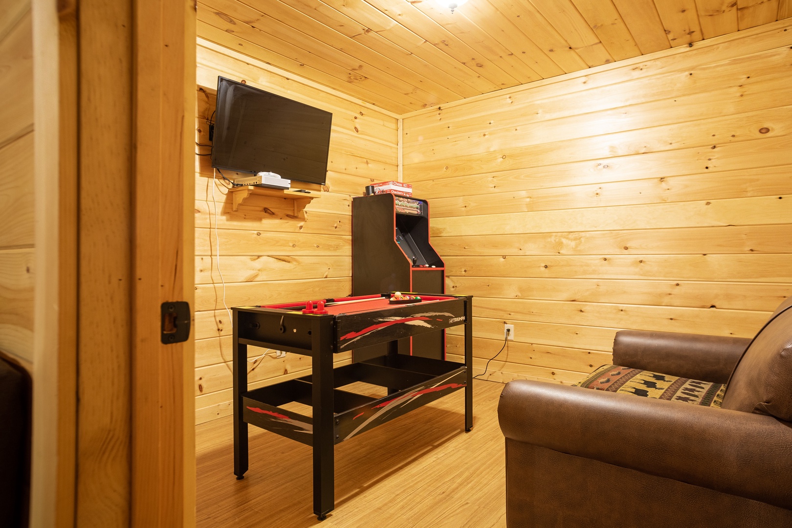 Arcade, TV, and Pool Table at 3 Crazy Cubs, a 5 bedroom cabin rental located in pigeon forge