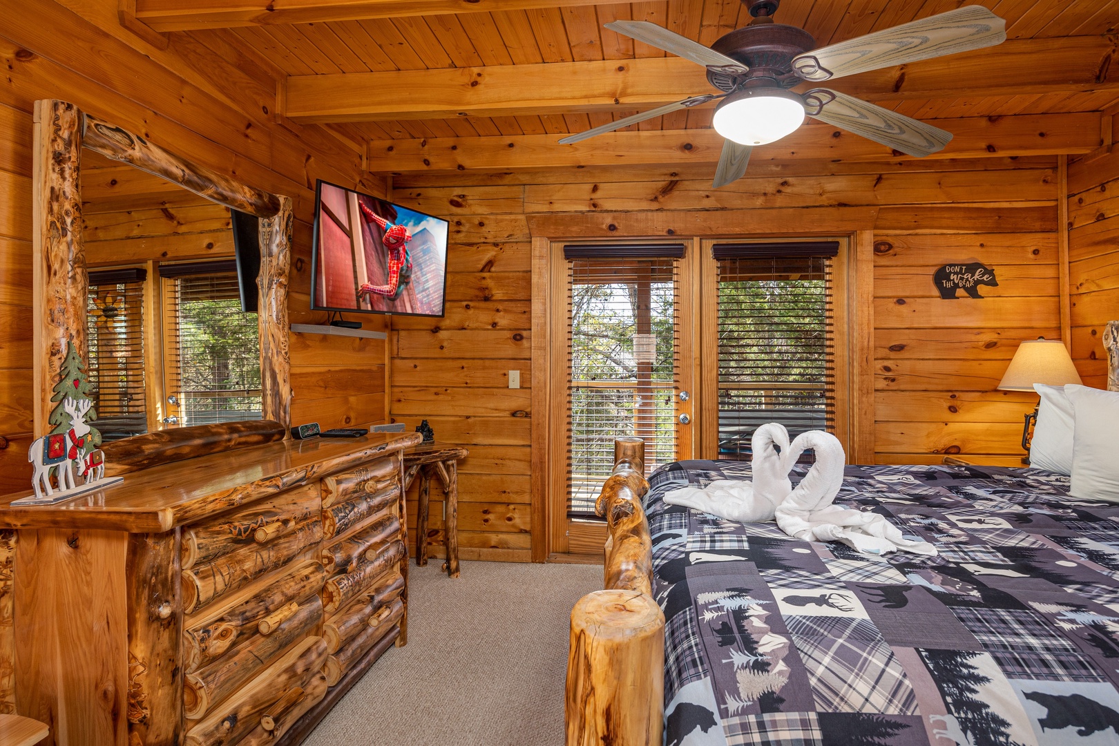 Wood dresser and flat screen tv in bedroom at Bear Feet Retreat, 1 bedroom cabin rental located in pigeon forge
