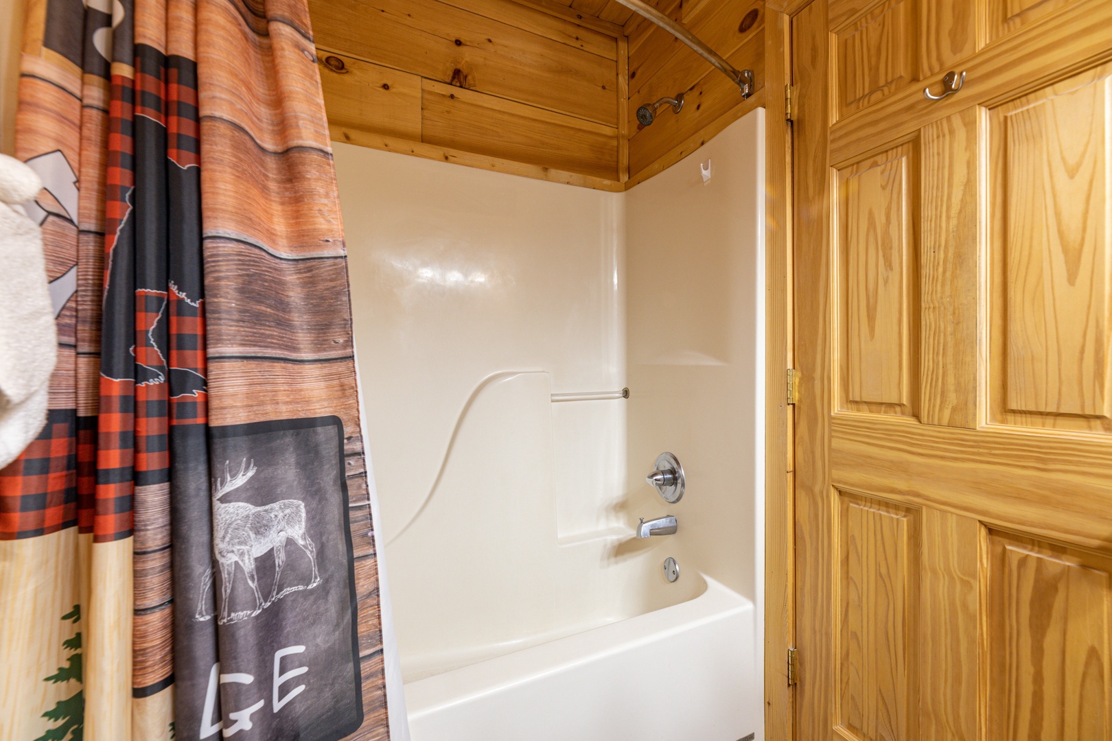 Bathroom with a tub and shower at Absolutely Wonderful, a 2 bedroom cabin rental located in Pigeon Forge