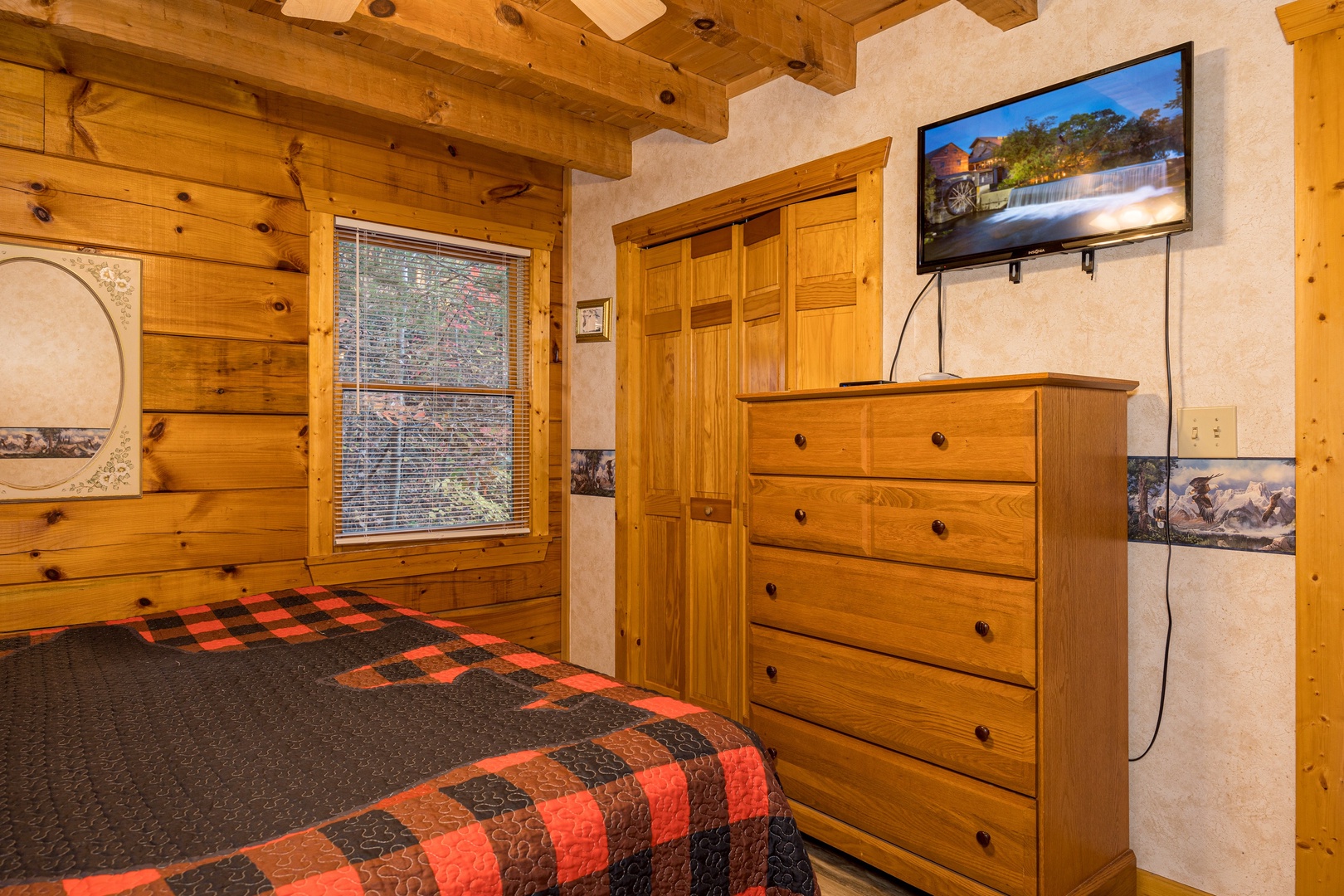 Flat screen tv in bedroom at Eagle's Loft, a 2 bedroom cabin rental located in Pigeon Forge