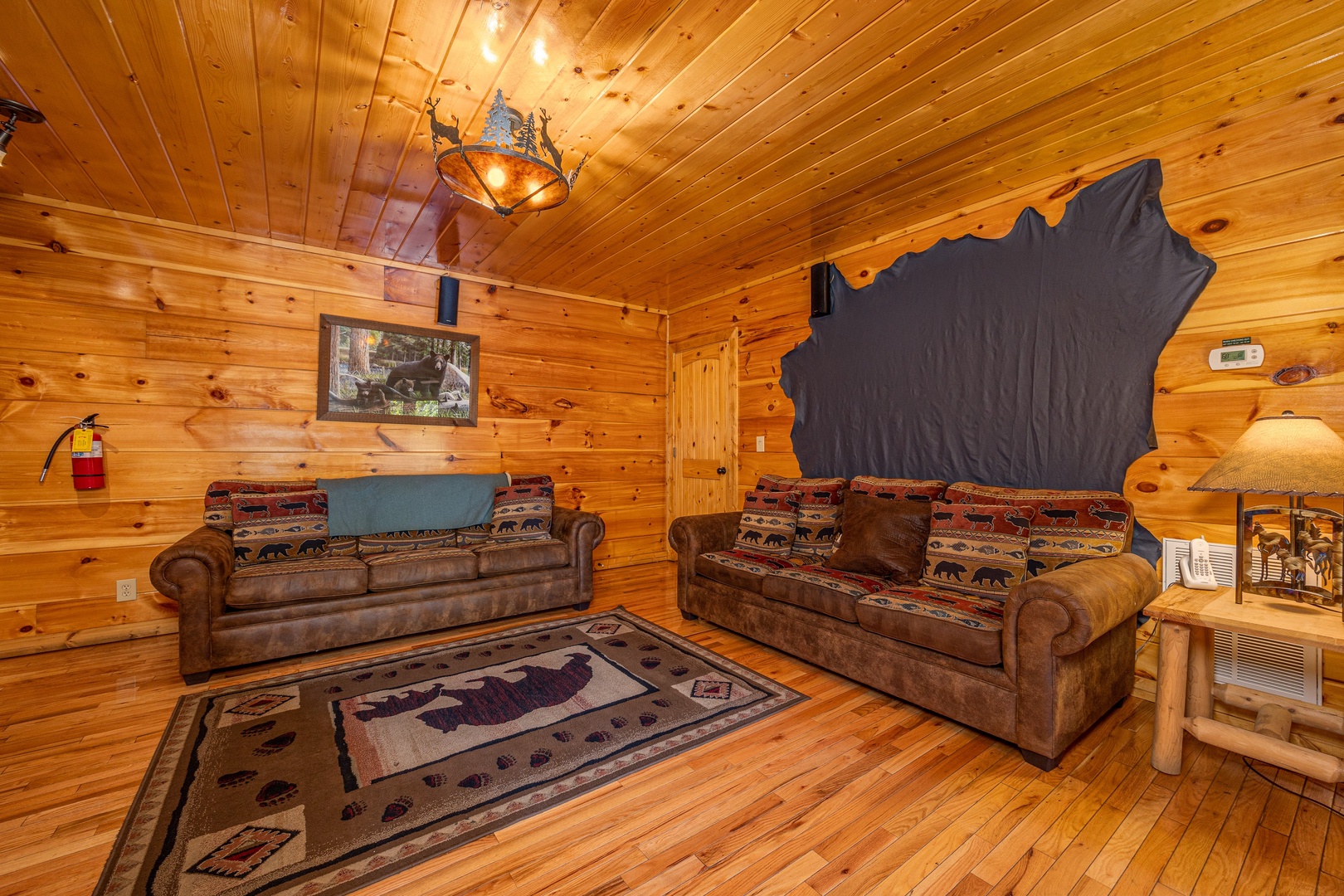 Den seating at The Great Outdoors, a 3 bedroom cabin rental located in Pigeon Forge