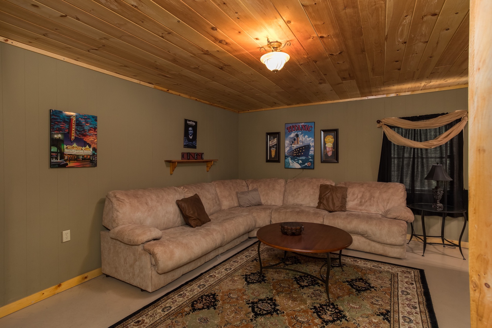 Large sectional sofa in the lower living room at Laid Back, a 2 bedroom cabin rental located in Pigeon Forge