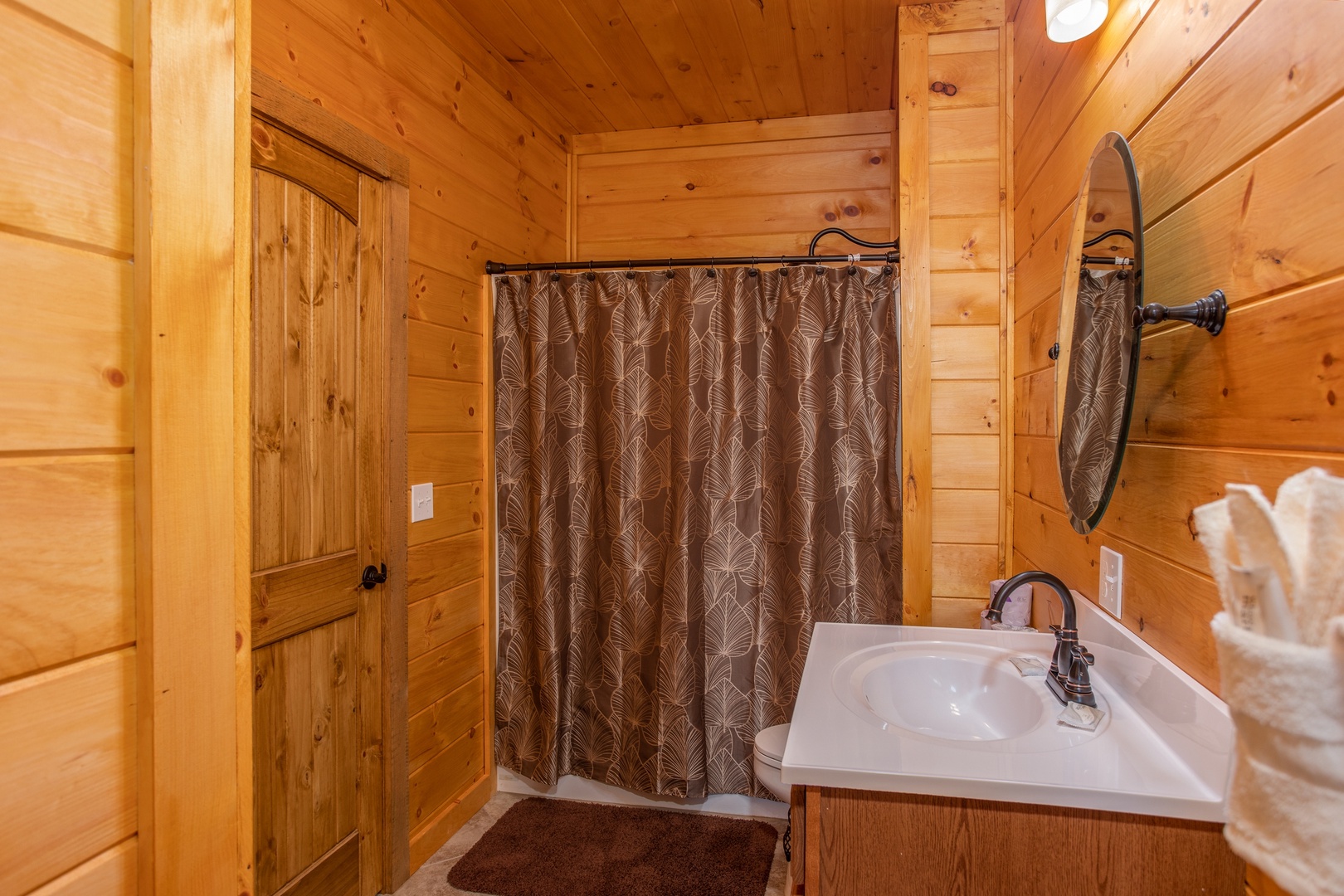 Bathroom with a tub and shower at Four Seasons Palace, a 5-bedroom cabin rental located in Pigeon Forge