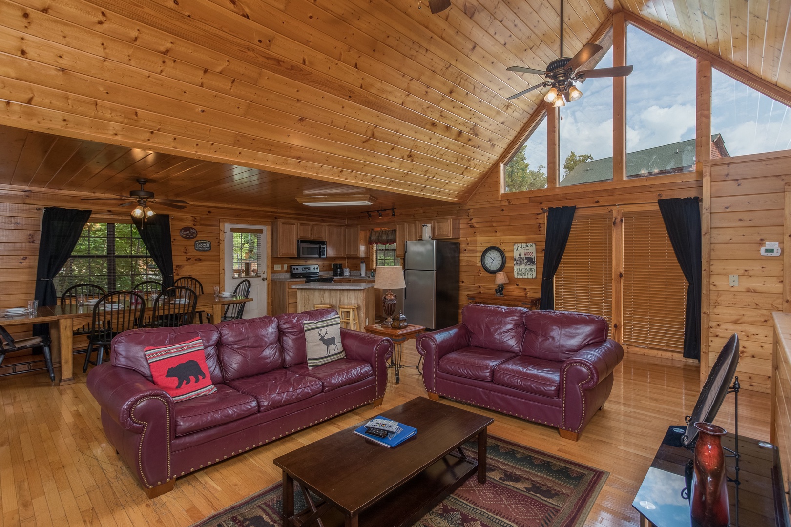 Sofa and loveseat in a living room Kick Back & Relax! A 4 bedroom cabin rental located in Pigeon Forge